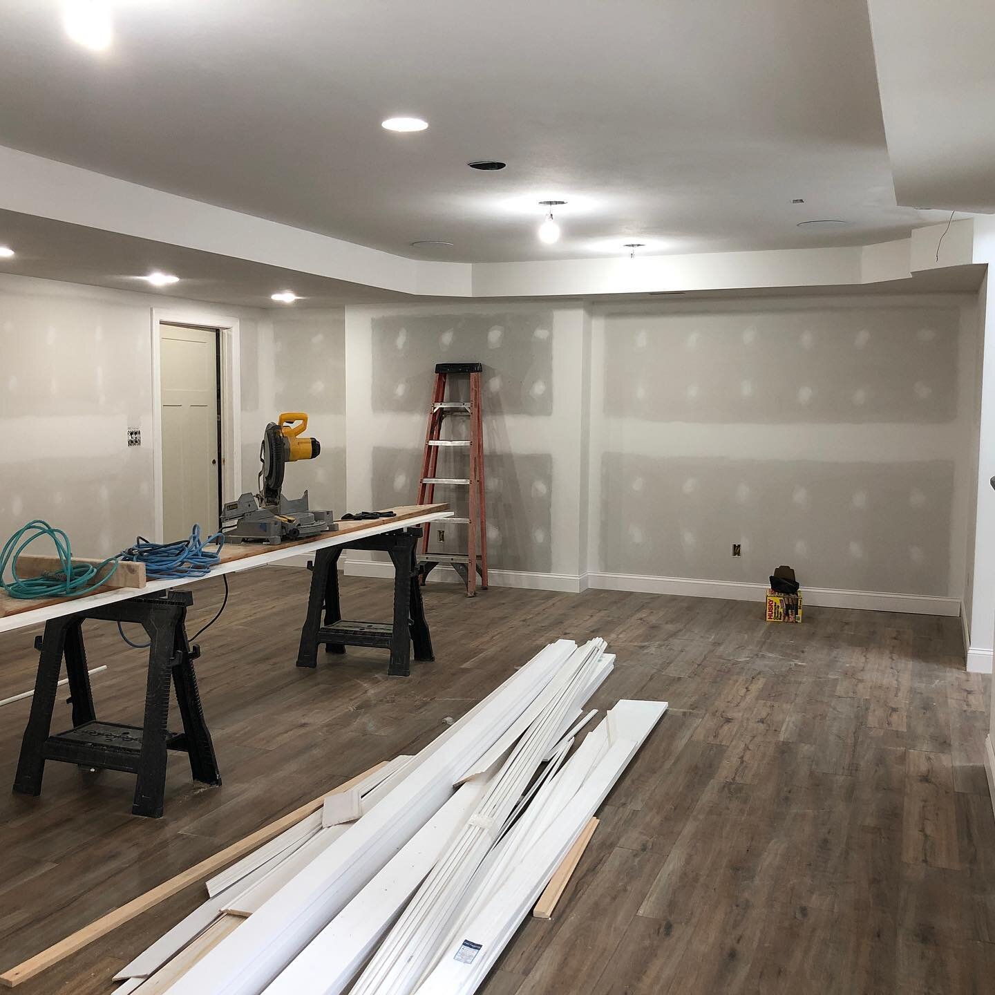 Custom pool house basement with walk out.  We are putting down the trim and vinyl plank flooring now that the drywall work is complete. Sonos and Truaudio indoor audio throughout.