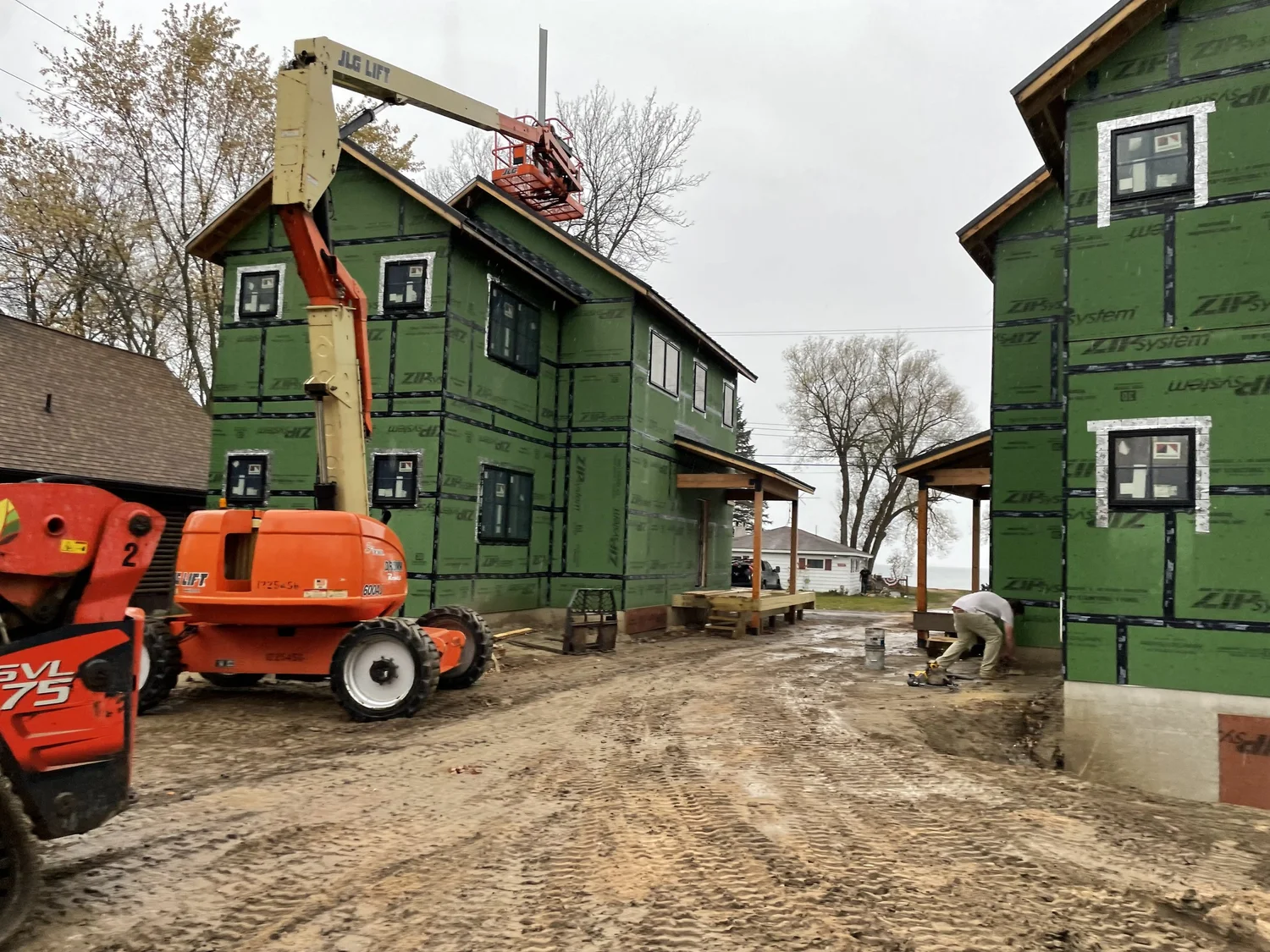 Residential general contractor Syracuse framing a two-story home with a lift