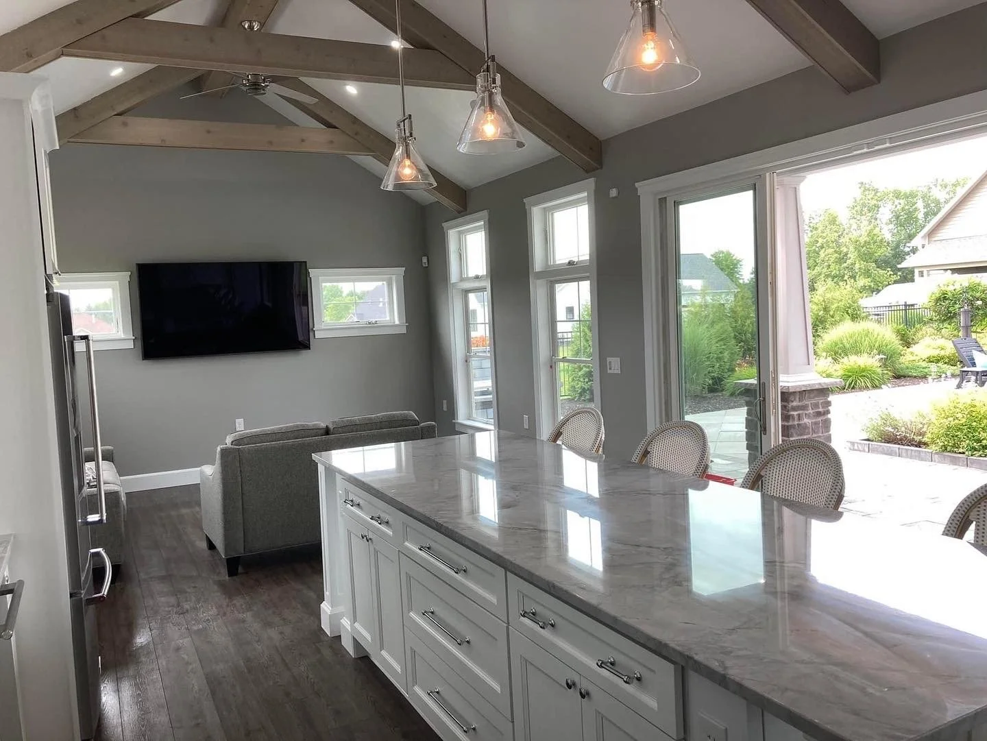 Whole house remodeling Syracuse NY open concept kitchen and living room with vaulted ceiling