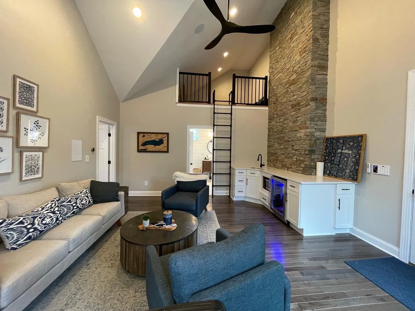 Remodeling contractors Syracuse NY vaulted living room with loft and large windows