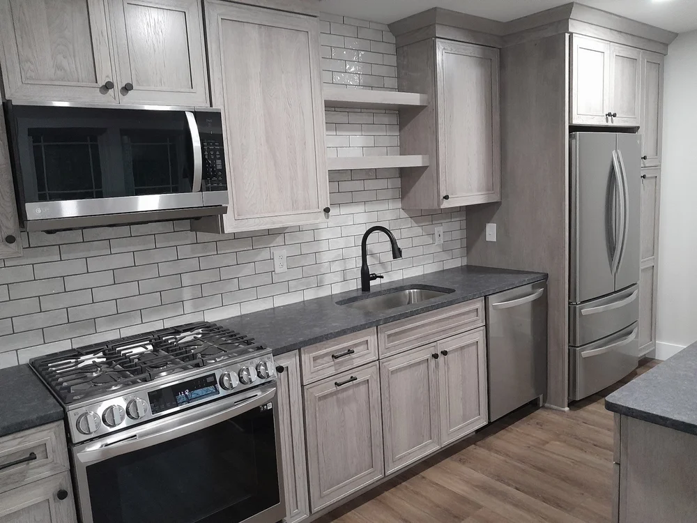 Kitchen renovation Syracuse with subway tile backsplash and stainless steel range