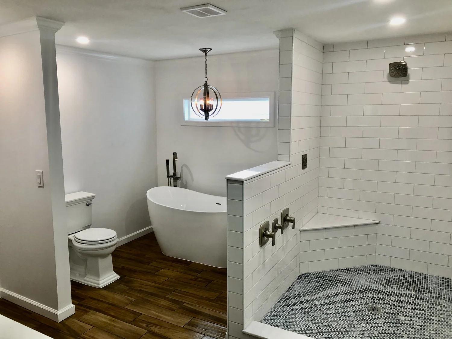 Custom bathroom remodel Syracuse NY with freestanding tub and walk-in tile shower