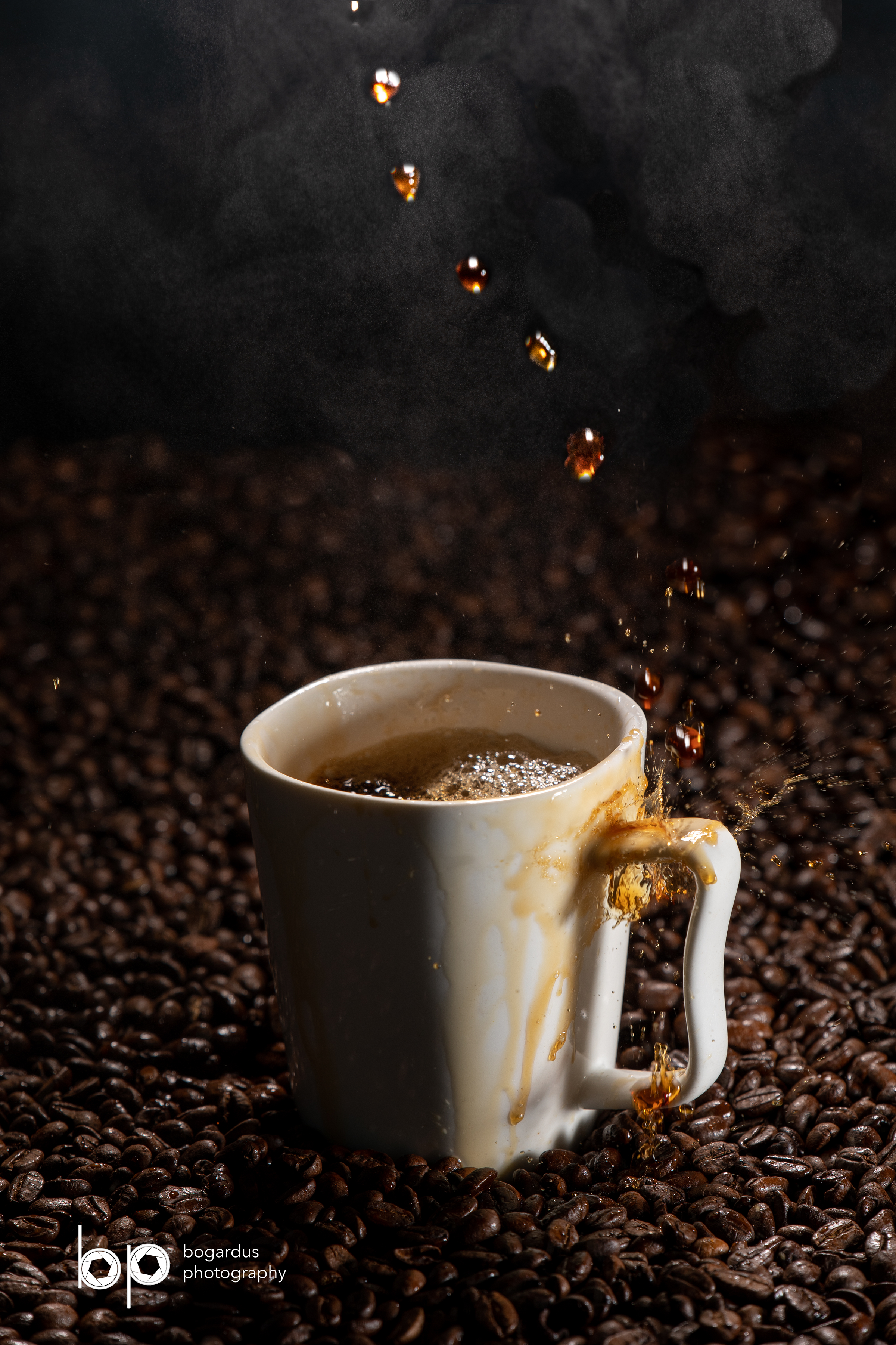 Coffee poured into mug sitting on field of coffee beans