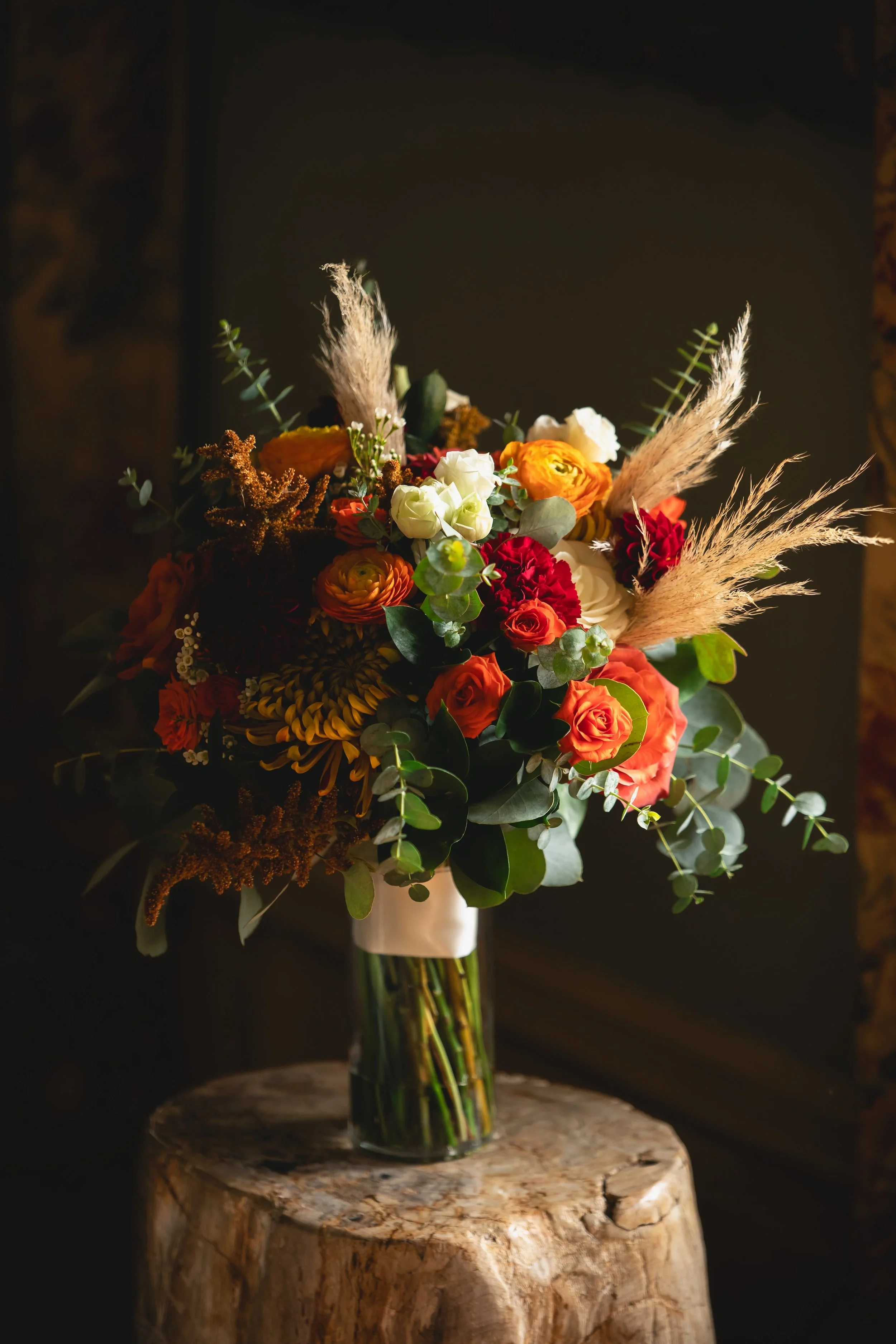 Fall Colors Wedding Bouquet in sunlight of window at FEAST at Round Hill Wedding Venue in Upstate NY