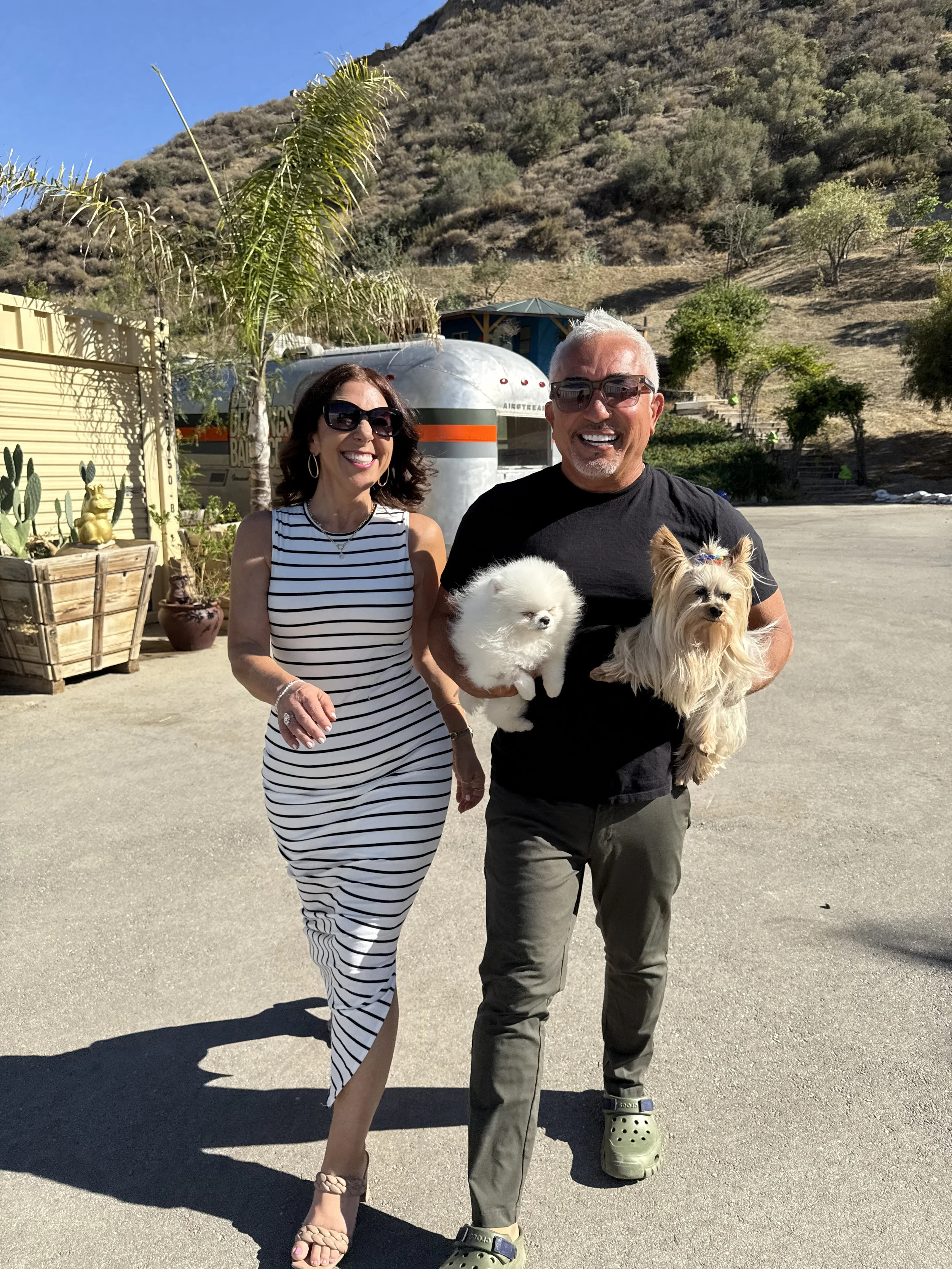 Kara and Cesar Millan walking.JPG