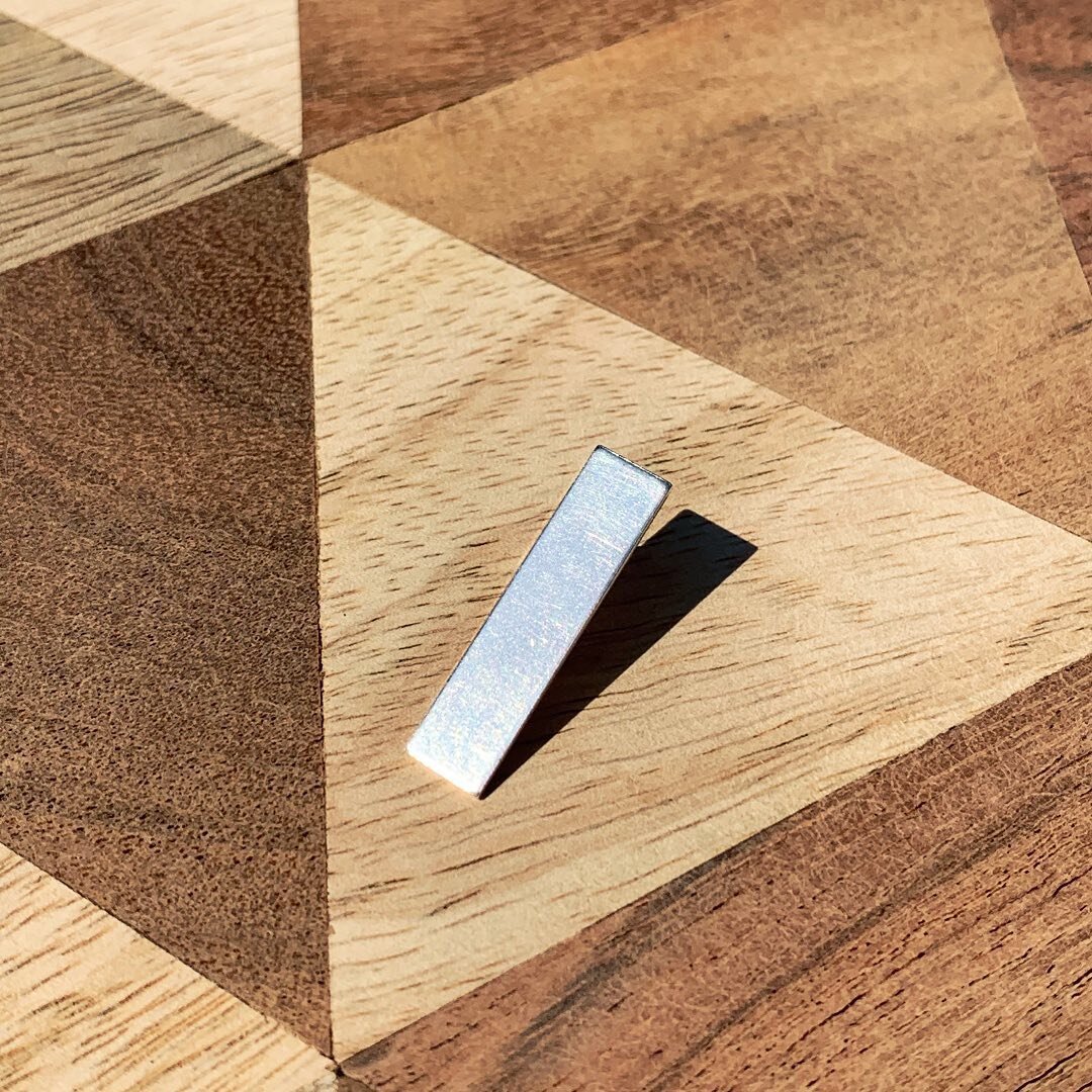 Have a look at this pair of simple geometric studs, hand made to last using only recycled materials! 

These studs are annealed and work hardened so they can keep up to being worn all day every day. 

Sterling Silver is nickel free, hypoallergenic, t