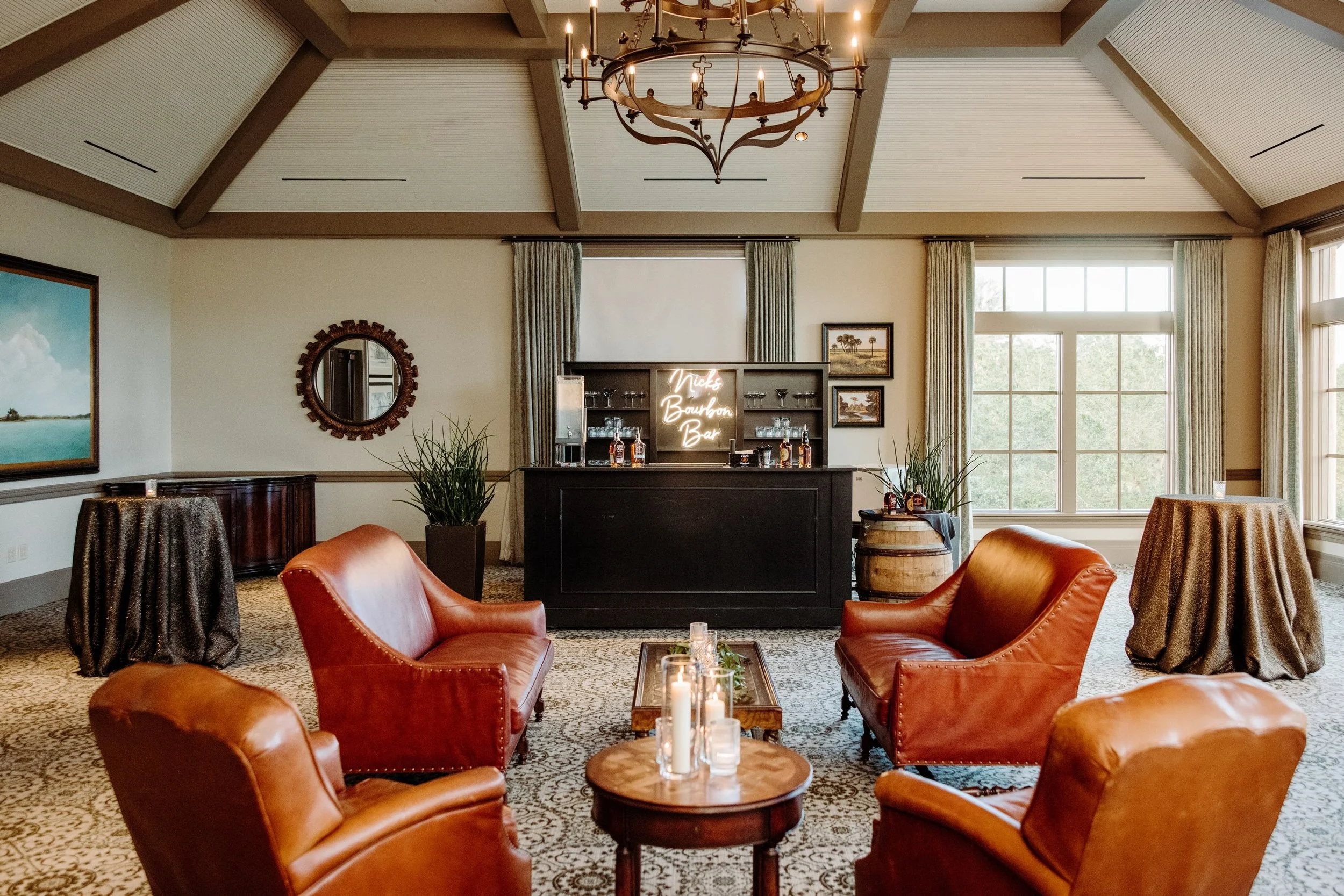 A Surprise Bourbon Bar!

This Father of the Bride wanted to add one more wow factor to the wedding, so we came up with the idea of a surprise bourbon bar!  After dinner, a set of doors opened to reveal a custom bourbon bar and cigar roller waiting fo