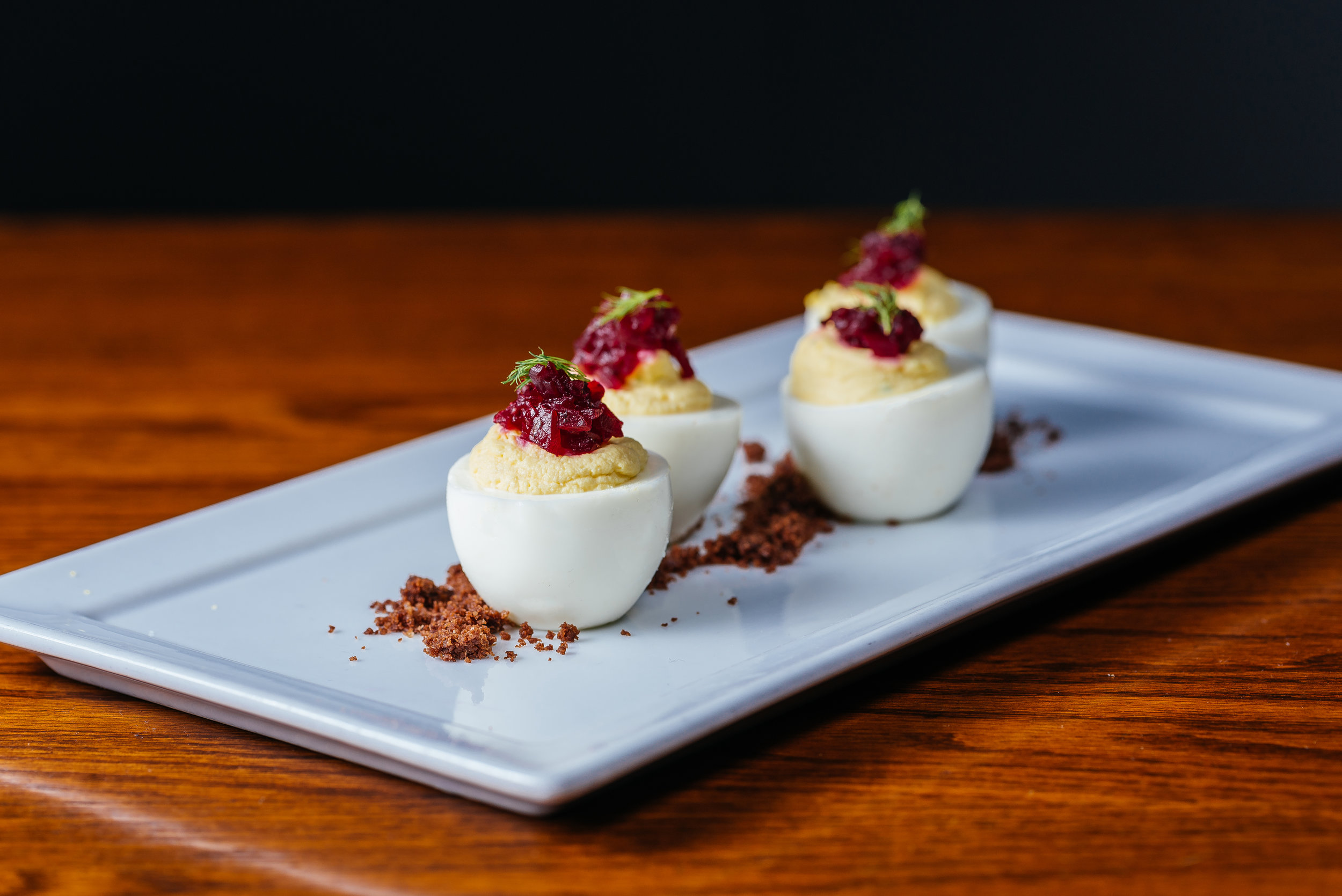Deviled eggs with horseradish soil and beet tartar
