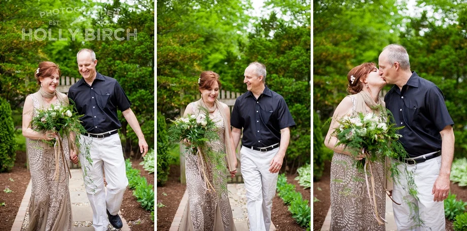 happy couple walking through the garden