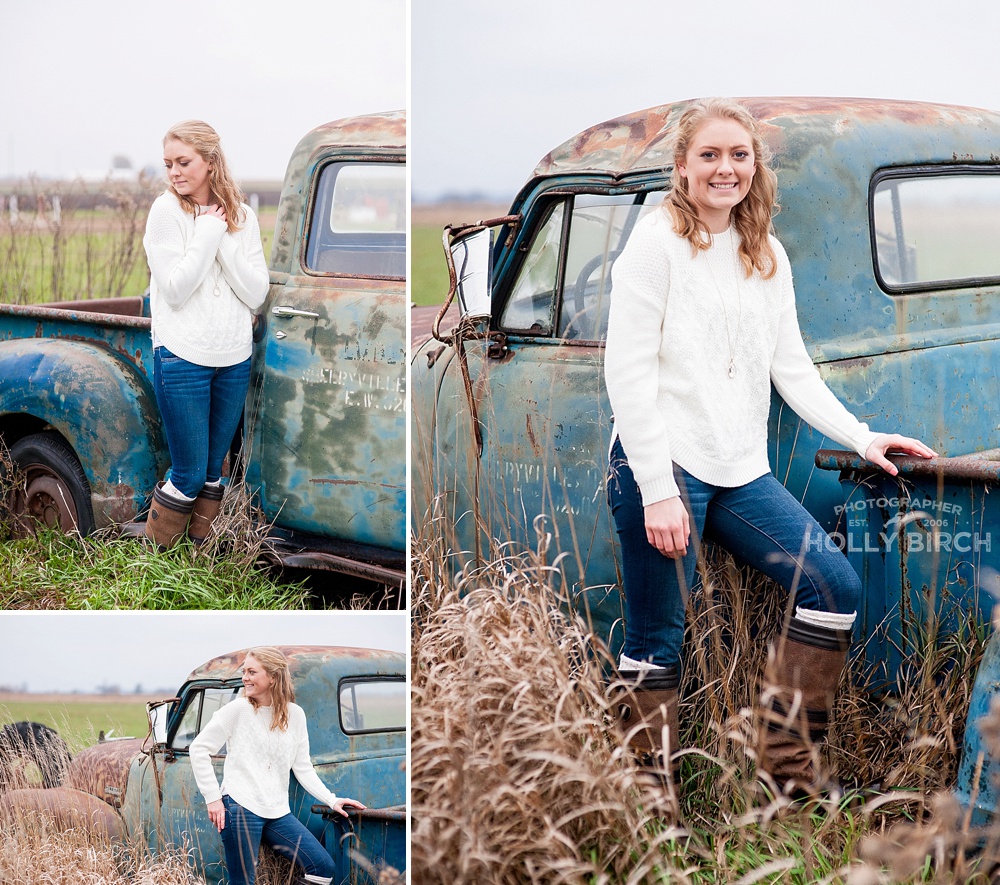 senior girl in white sweater with rusty blue truck