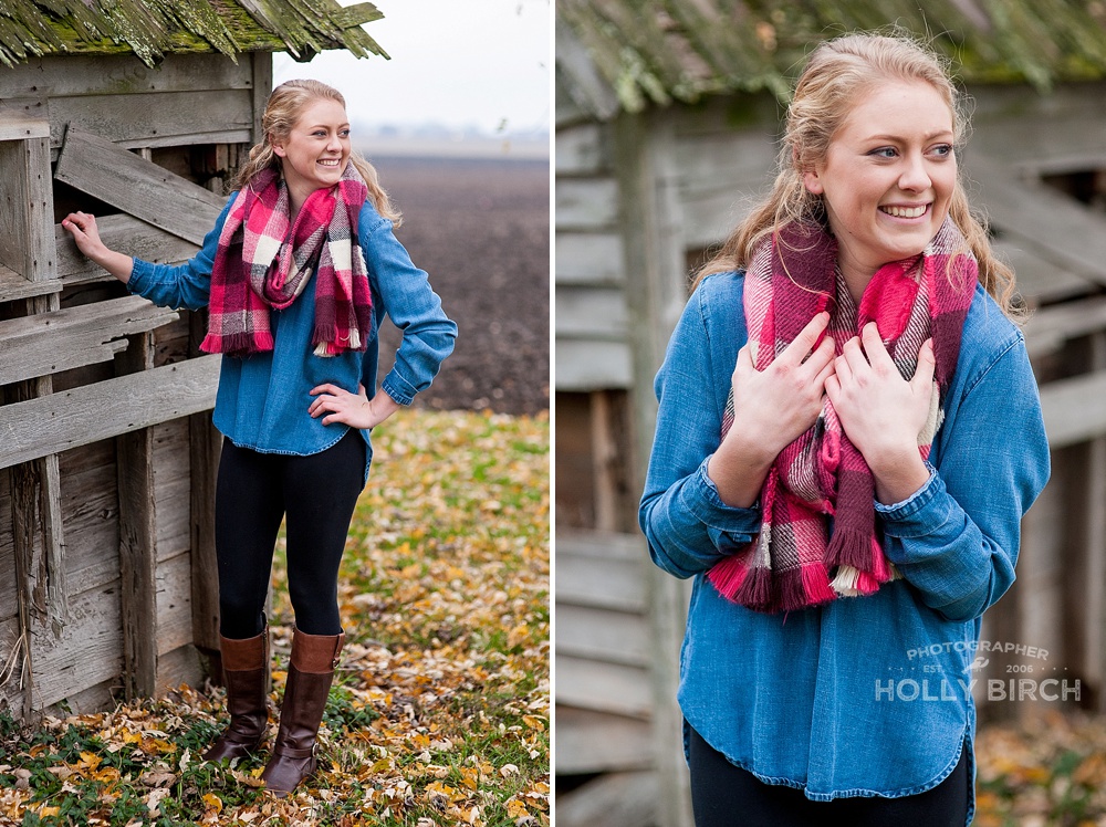 senior girl with chunky scarf and dilapidated building
