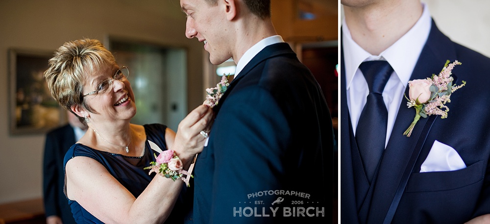 mother of groom putting on boutonneire