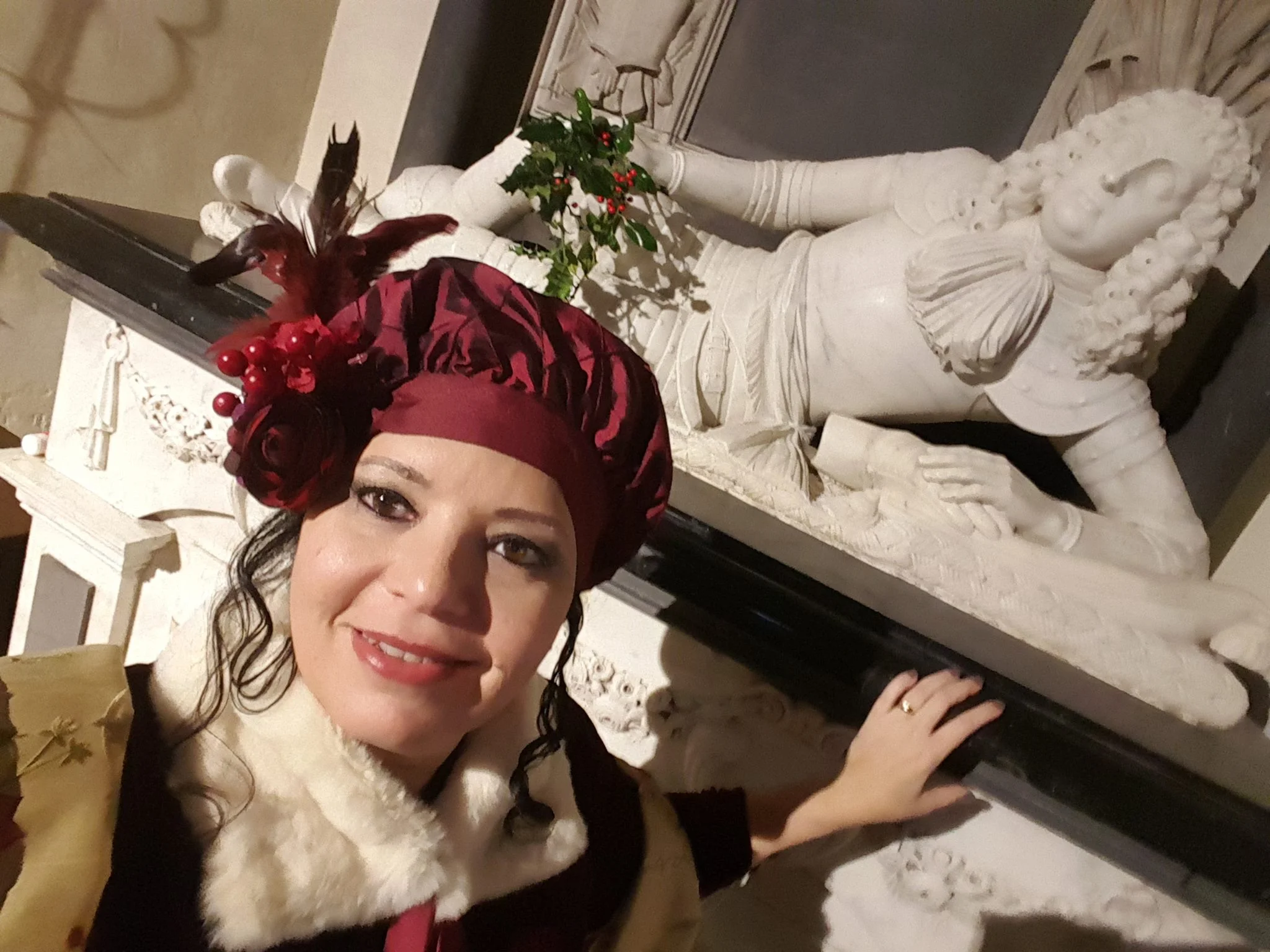 Rita L Watts putting holly in Sir Richard's hand