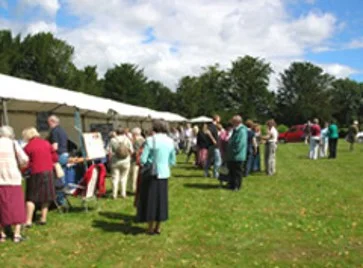 Visitors enjoying the sunshine at the JASUK AGM on the lawns of Chawton House