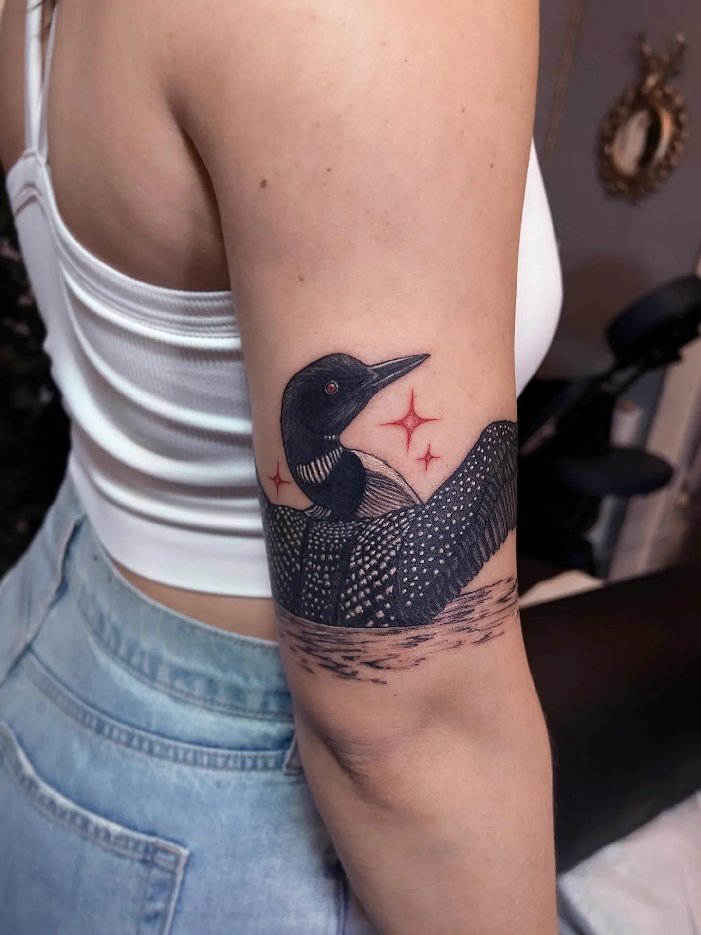 Common loon 🌙 armband. Thanks for visiting from Minnesota to get a tattoo of your state bird! Just returned from my childhood home in northern Wisconsin a few days ago and while there got to hear some beautiful loon calls over the water (and see the