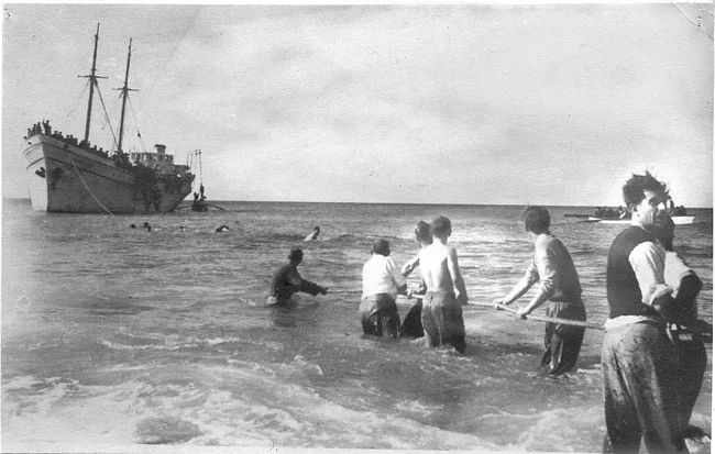 An Aliyah Bet ship unloads Jewish refugees on the beach in Nahariyah, having successful run the British blockade. Photo source: Palyam.org