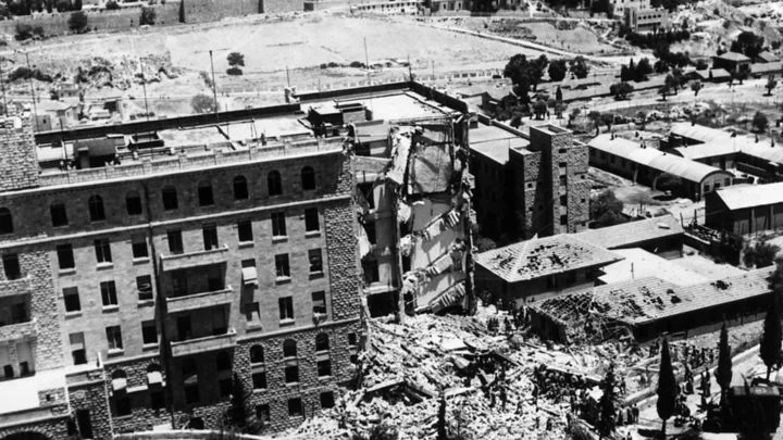 The destroyed southern wing of the King David Hotel in Jerusalem. You can see the walls of the Old City in the far background at the top left. Photo source: the BBC