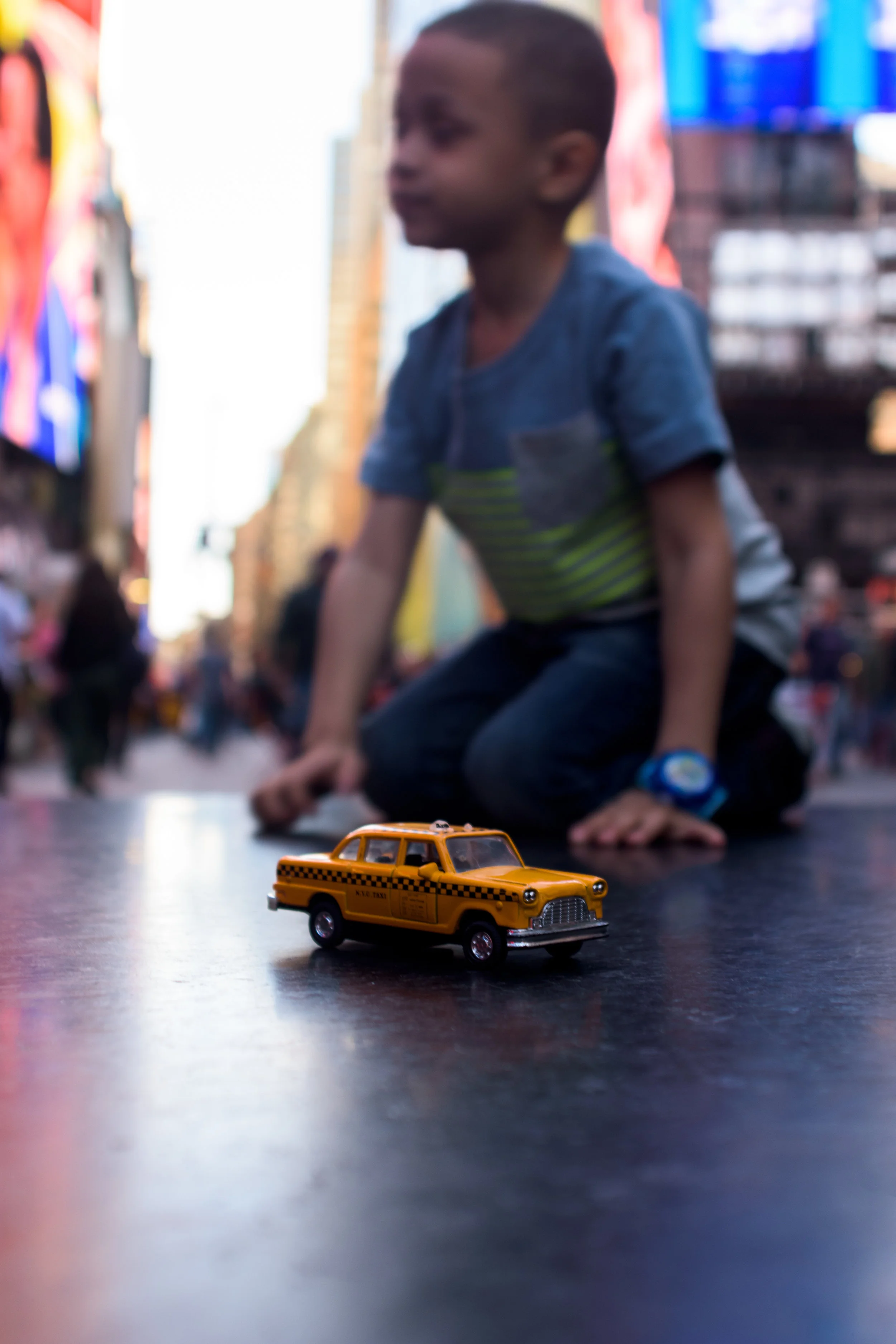 toy taxi with kid.jpg