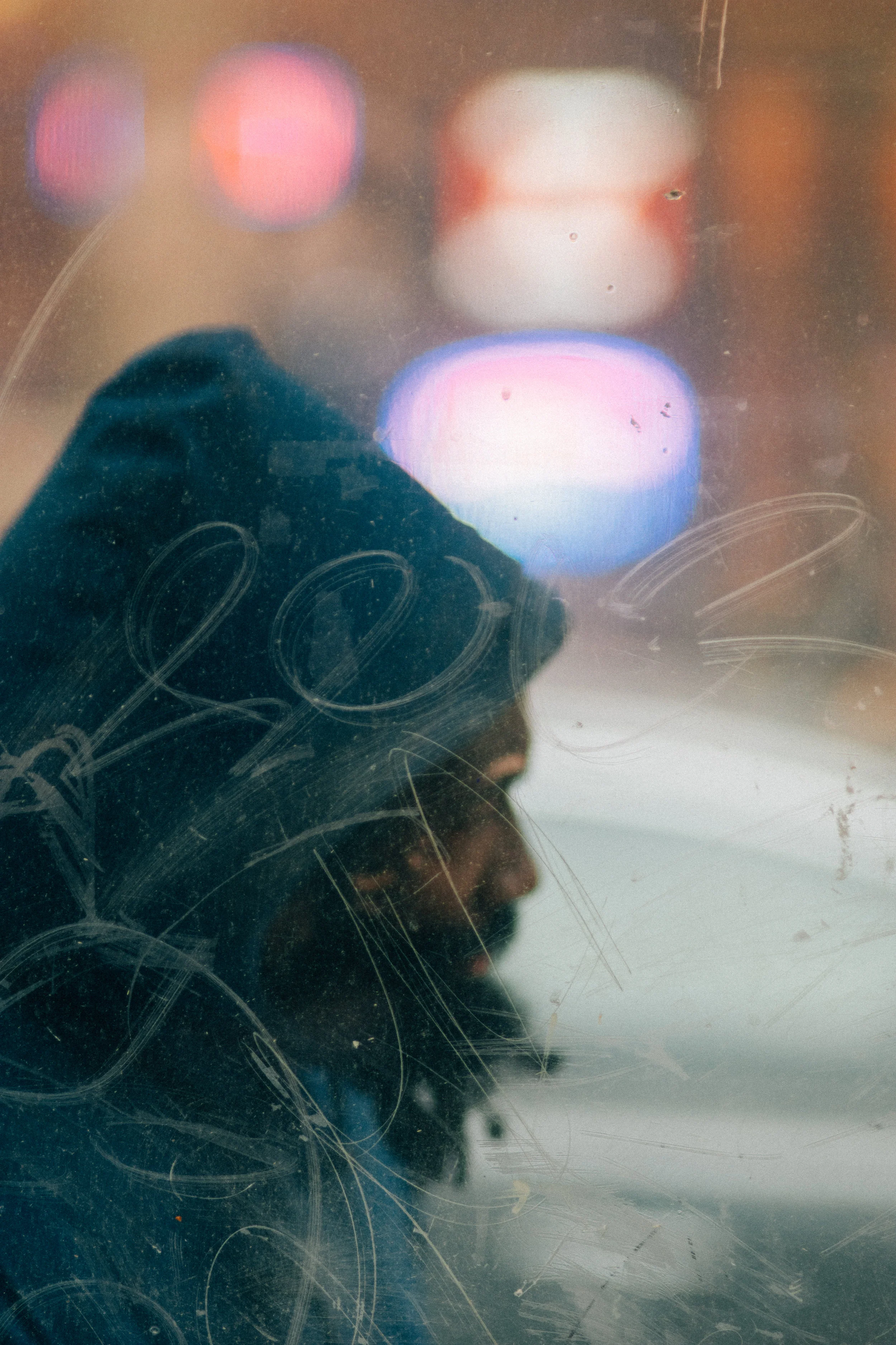 man through scratched glass.jpg