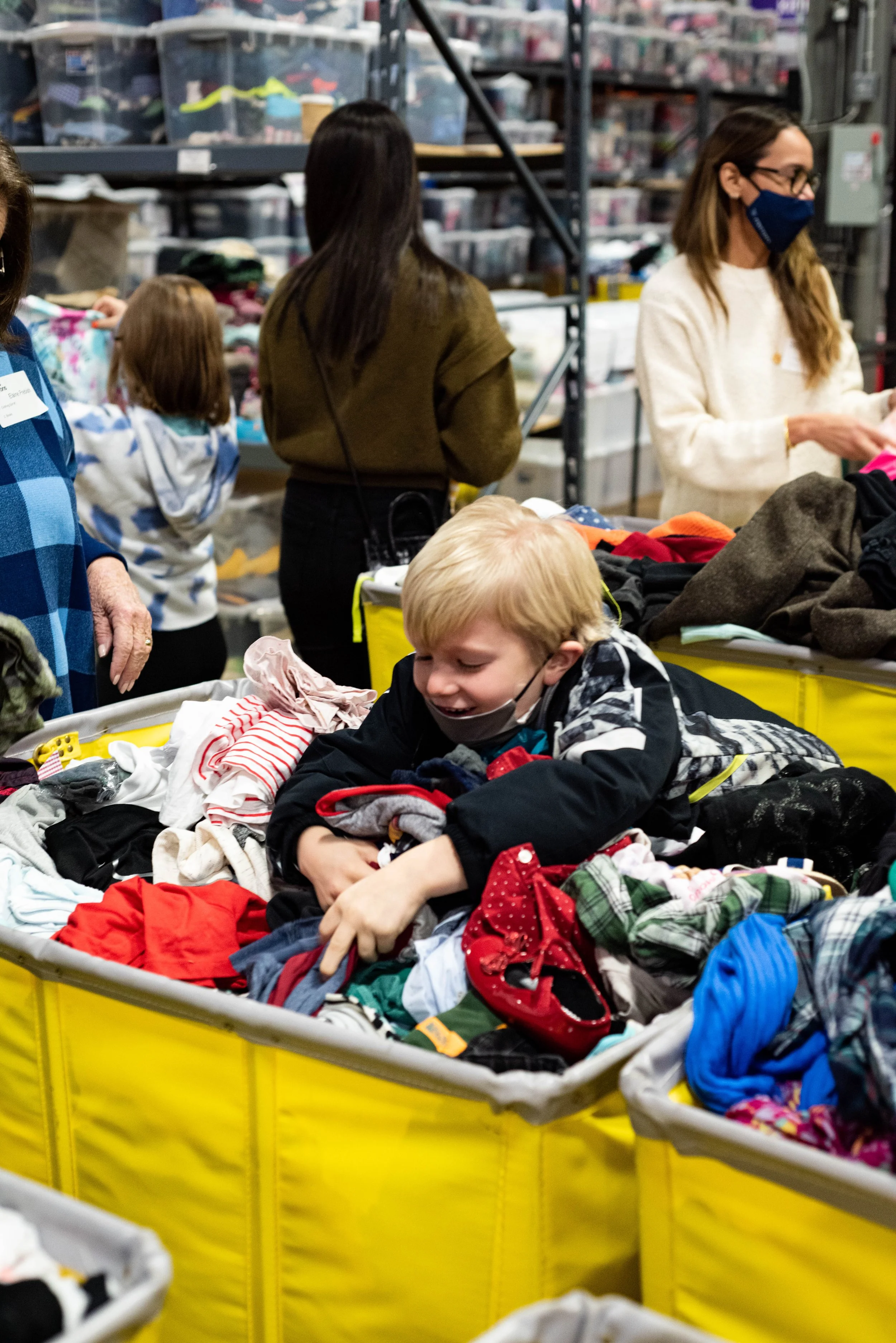 boy playing in the clothes.jpg