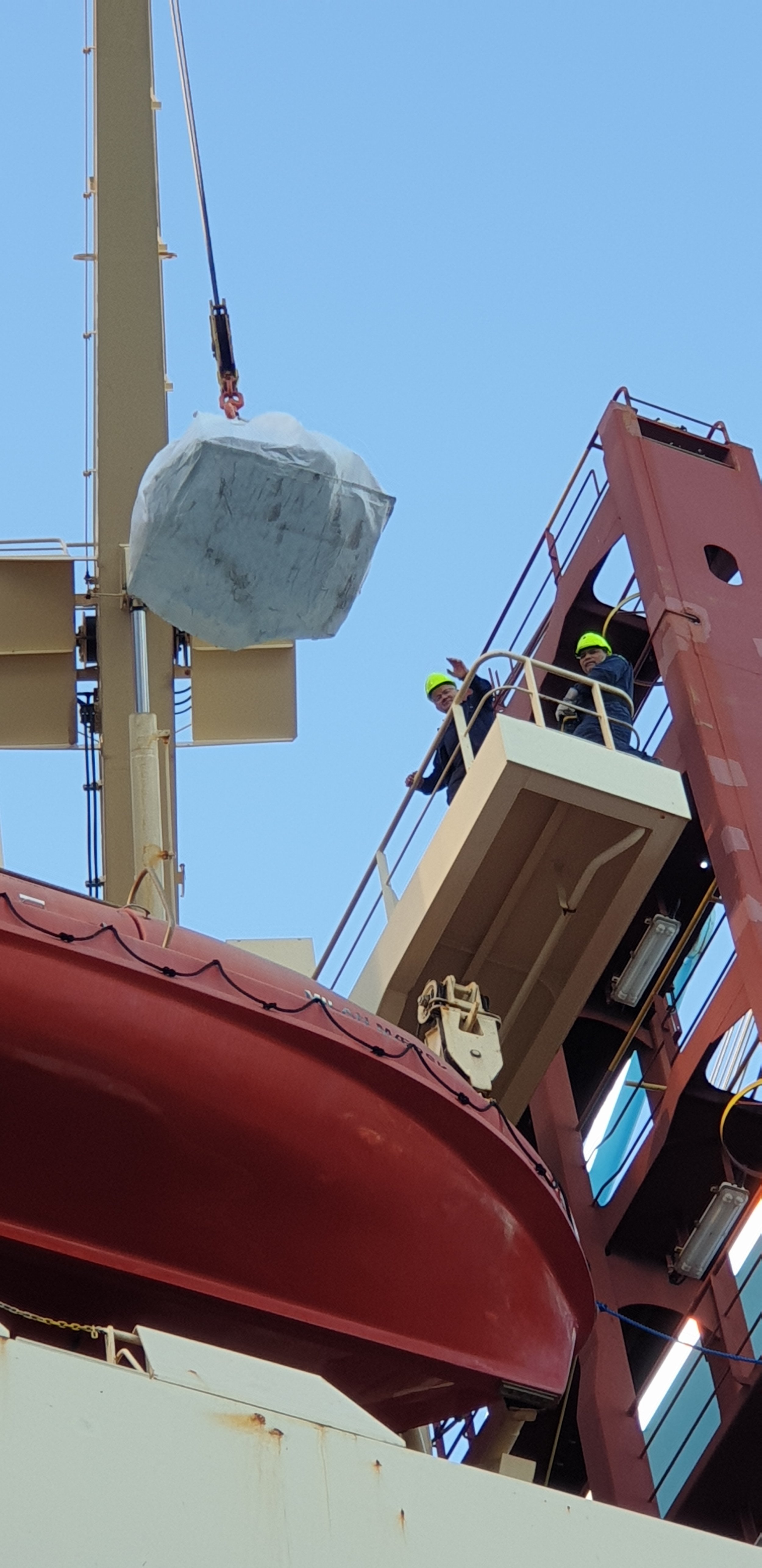 Milan Maersk Captain Regin lifts up the presents.jpg