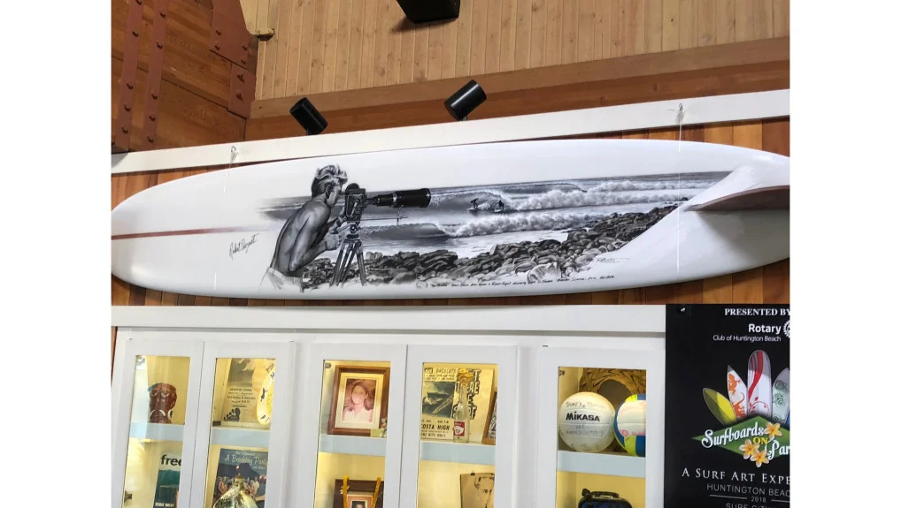 Phil Roberts depicted a never-before scene moment from the film Endless Summer, a cult-classic film from the 60s. The board is on auction during the Surfboards on Parade gala on Sunday, Oct. 6, an event that raises money for skin cancer research. (Photo courtesy Roberts)