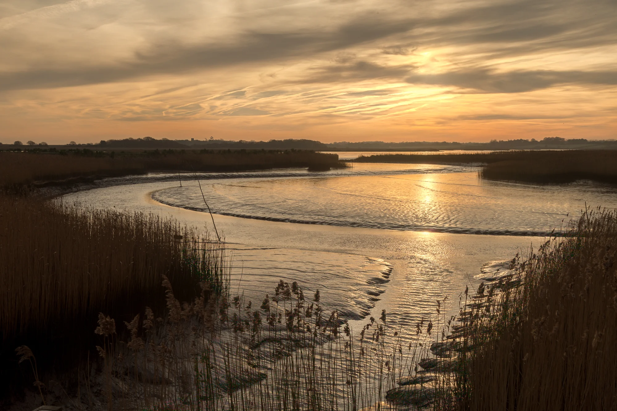 The sweeping curves of the River Alde drifting through the reeds