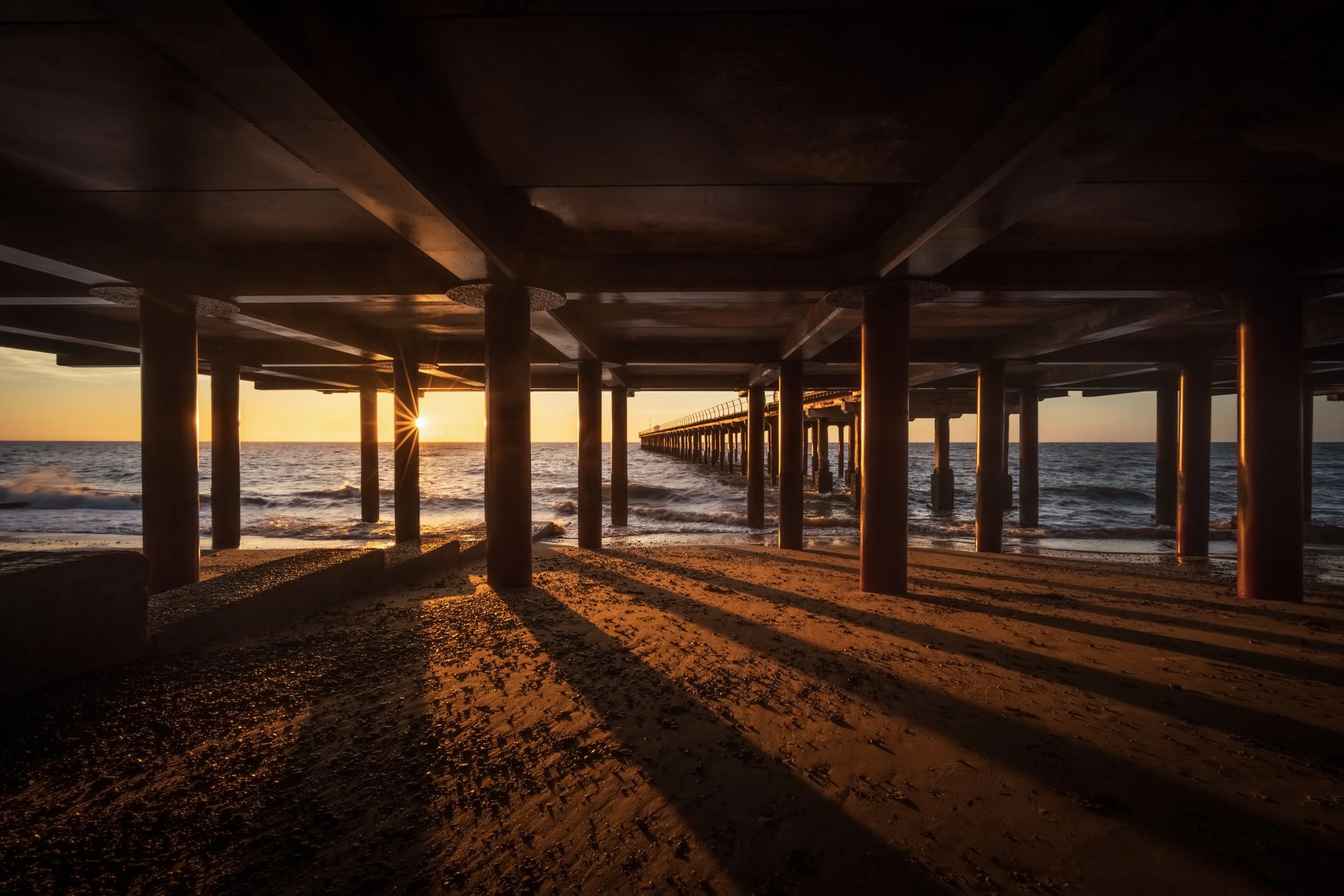 Light and shadow under Felixstowe Pier, Suffolk