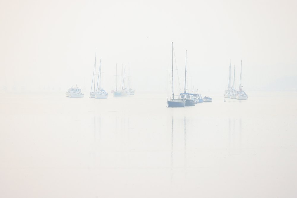 Boats on a misty River Orwell, Suffolk