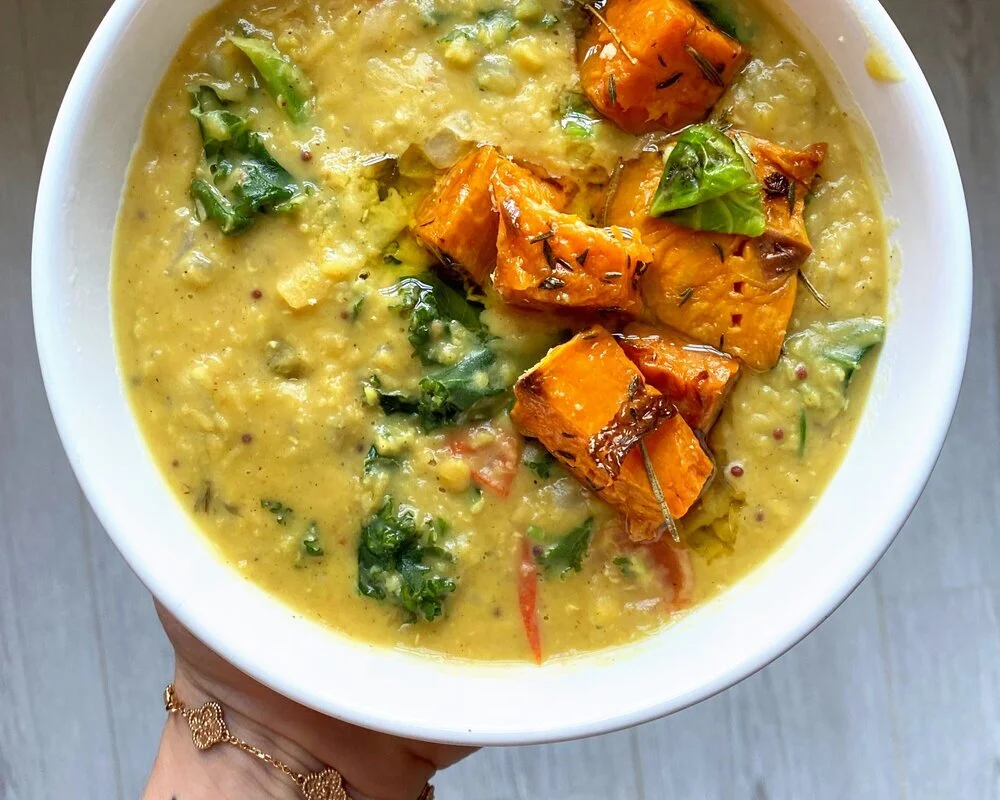 Warming red lentil dhal with leafy greens and sweet potato