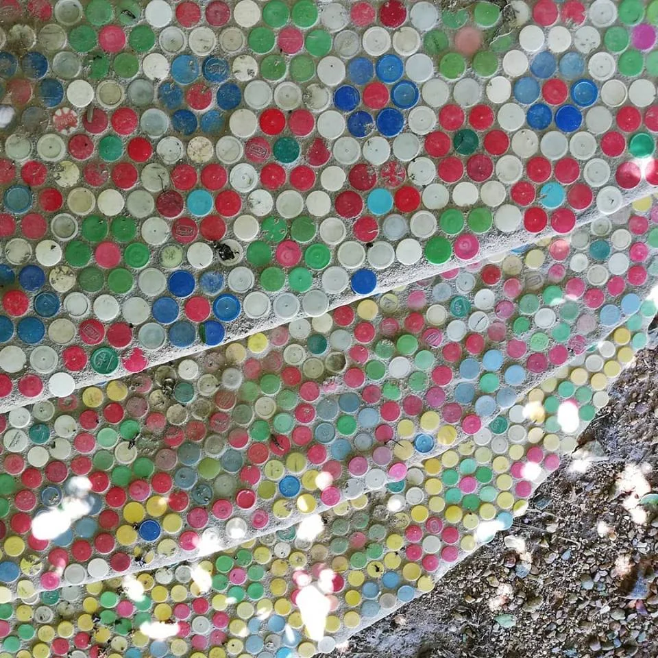 Steps decorated with plastic lids.