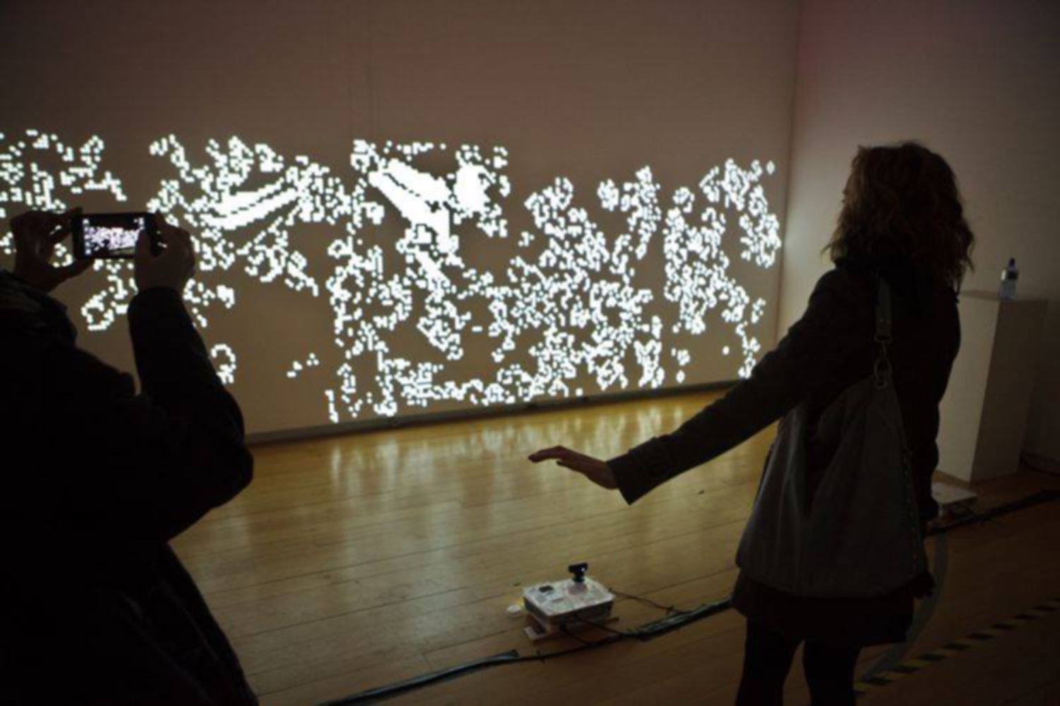 human interaction with a motion sensitive camera and projection mapping