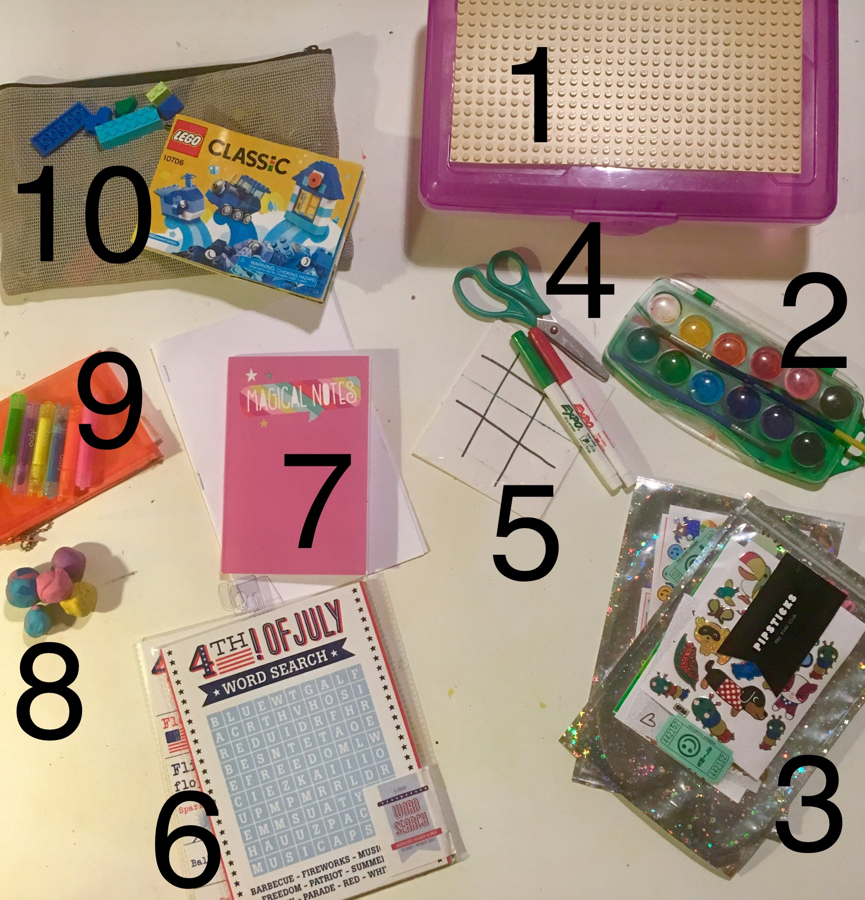 1. Plastic snap-lid oversized pencil box with a piece of LEGO "land" cut to size and hot glued to top. 2. Kids pan watercolor set and brush (all you need is paper, a water cup to wash your brush, and a napkin to dry your brush 3. Stickers! We subscribe to a monthly sticker club and it's AWESOME! 4. Scissors 5. Dry erase markers and a homemade double-sided tic tac toe/what we call the "making squares" game...does anyone know the official name?...on a heavy piece of paper wrapped in clear packing tape. 6. Games from the dollar bin...word search, car bingo... 7. A notepad, copy paper folded and stapled into a blank sketchbook, watercolor scrap paper 8. Modeling clay 9. Markers and a soft carrying pouch 10. LEGO's and a carrying pouch Optional: Figurines , washi tape, pencils, puzzles, a Spirograph ...the possibilities are endless...space dependent ;-)