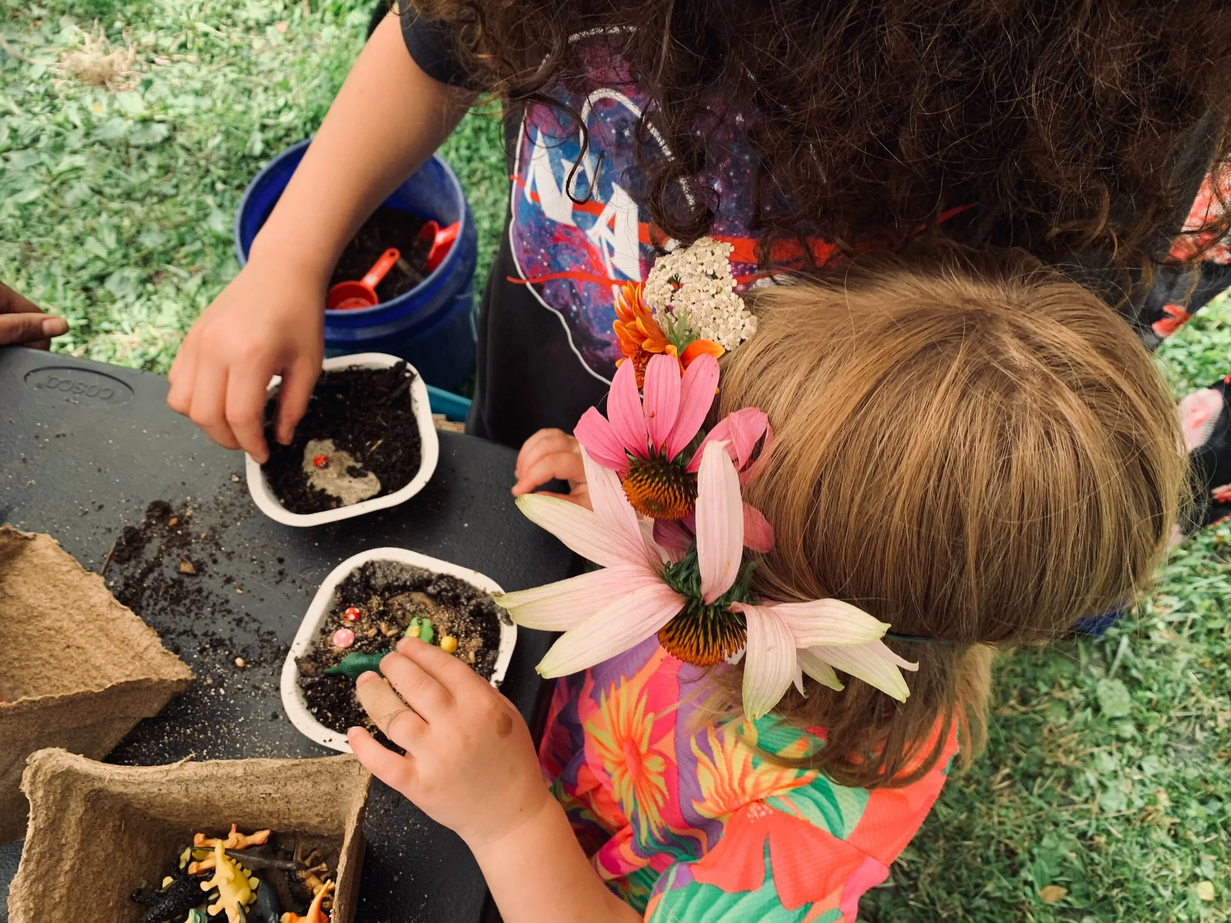 Children doing an activity at a community event at the Patrick Kaufman Memorial Learning Garden.