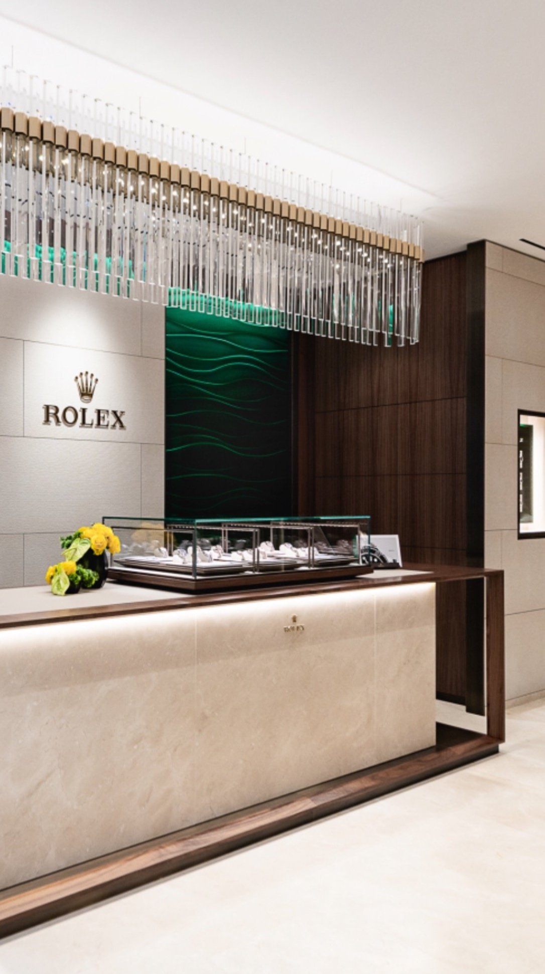 Commercial and retail floristry brand installation at the Rolex Boutique in Glasgow by Atelier Rosa, creating luxury floral installations for corporate and retail environments.
