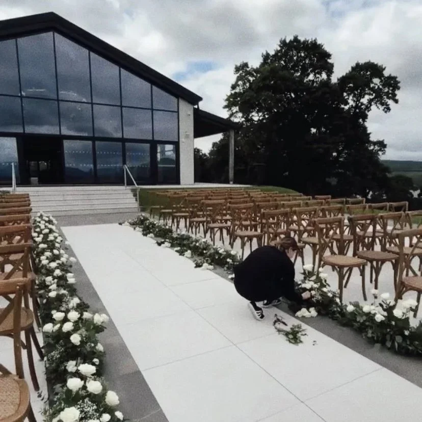 Luxury white wedding installations at Boturich Castle, Scotland by Atelier Rosa Glasgow, specialising in large-scale floral design and wedding styling across Scotland.