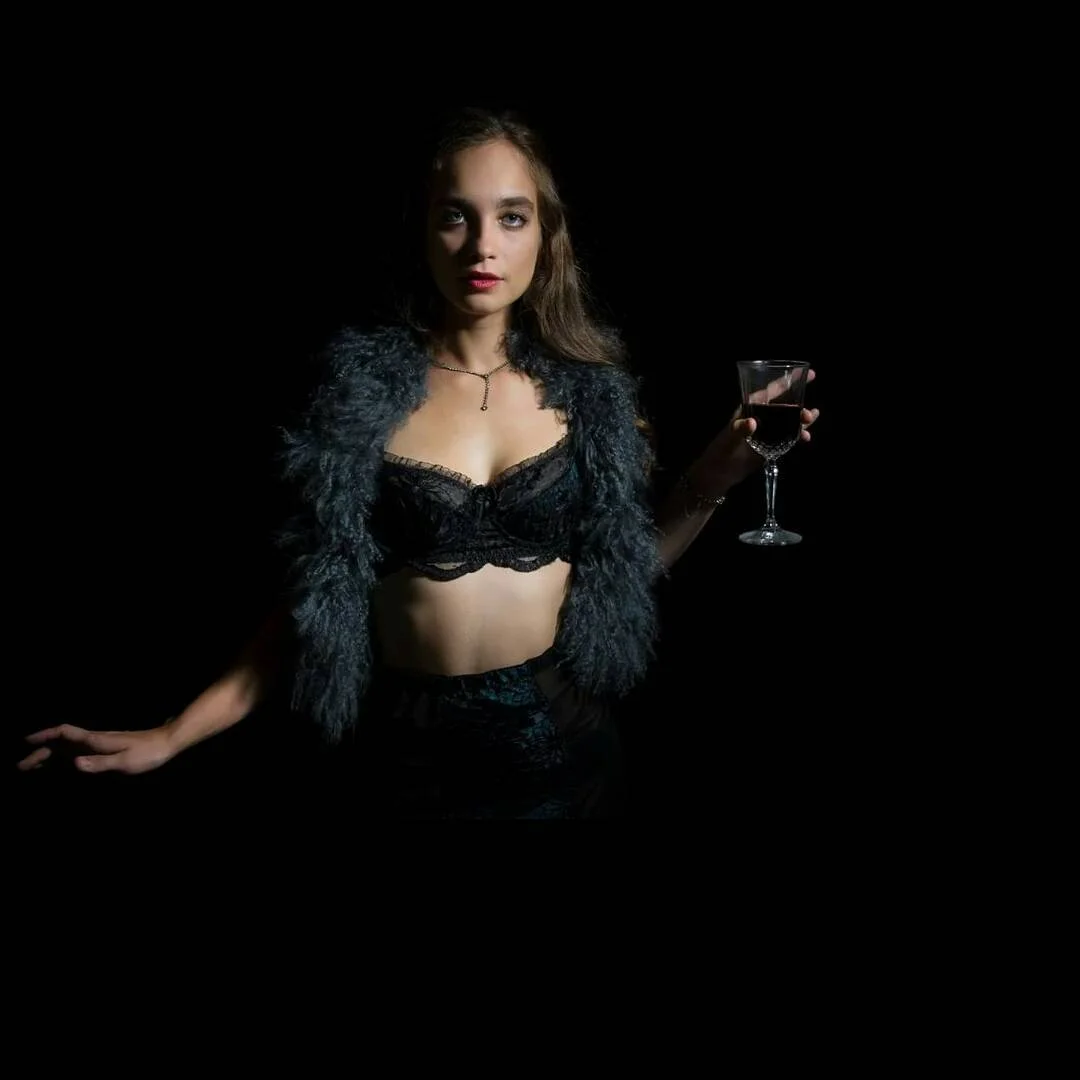 Model wearing black lingerie from the curated collection of VaVaVooom in Asheville NC.