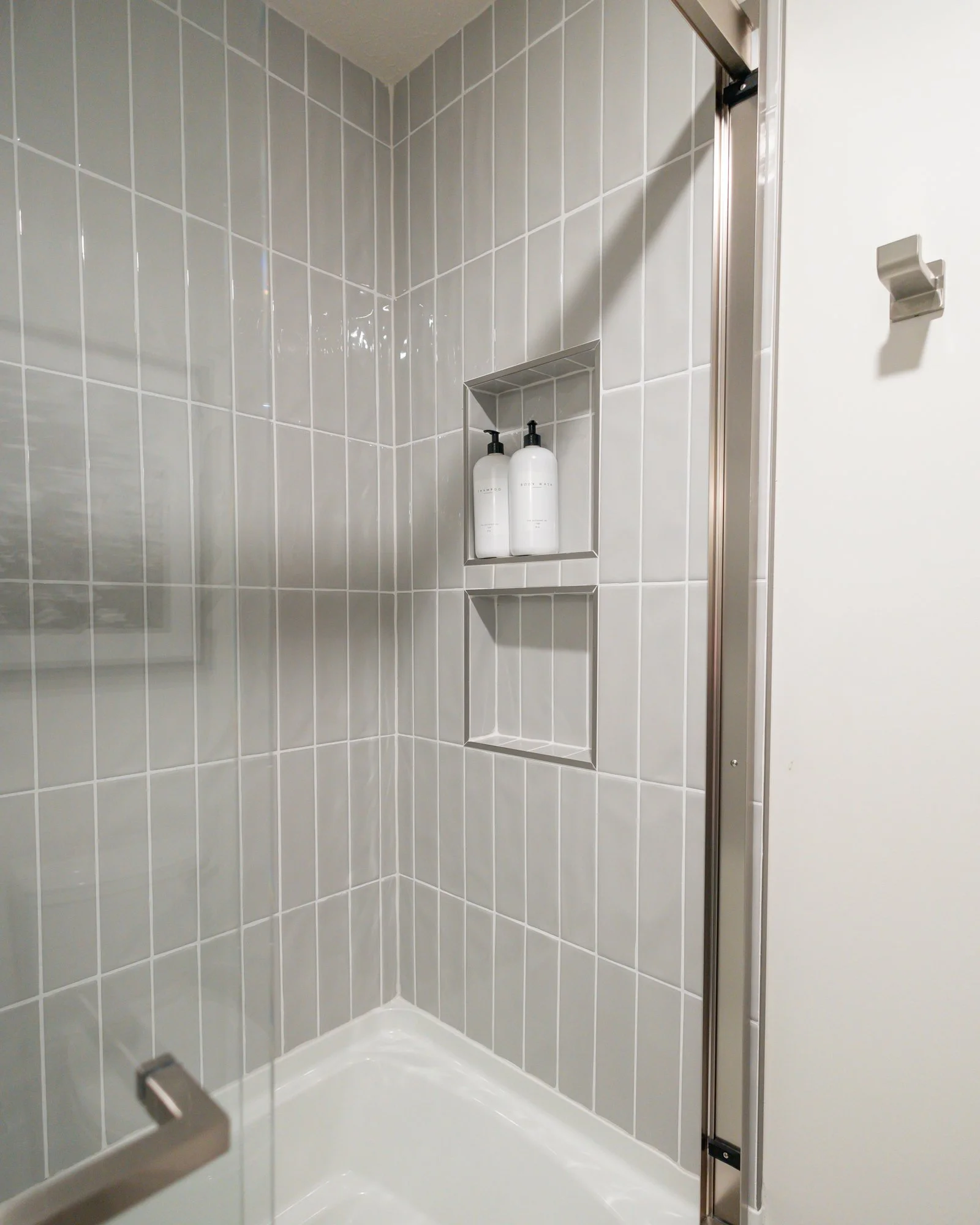 7 - ©2023 WAYS Interiors - Bressman - Hall Bath.jpg