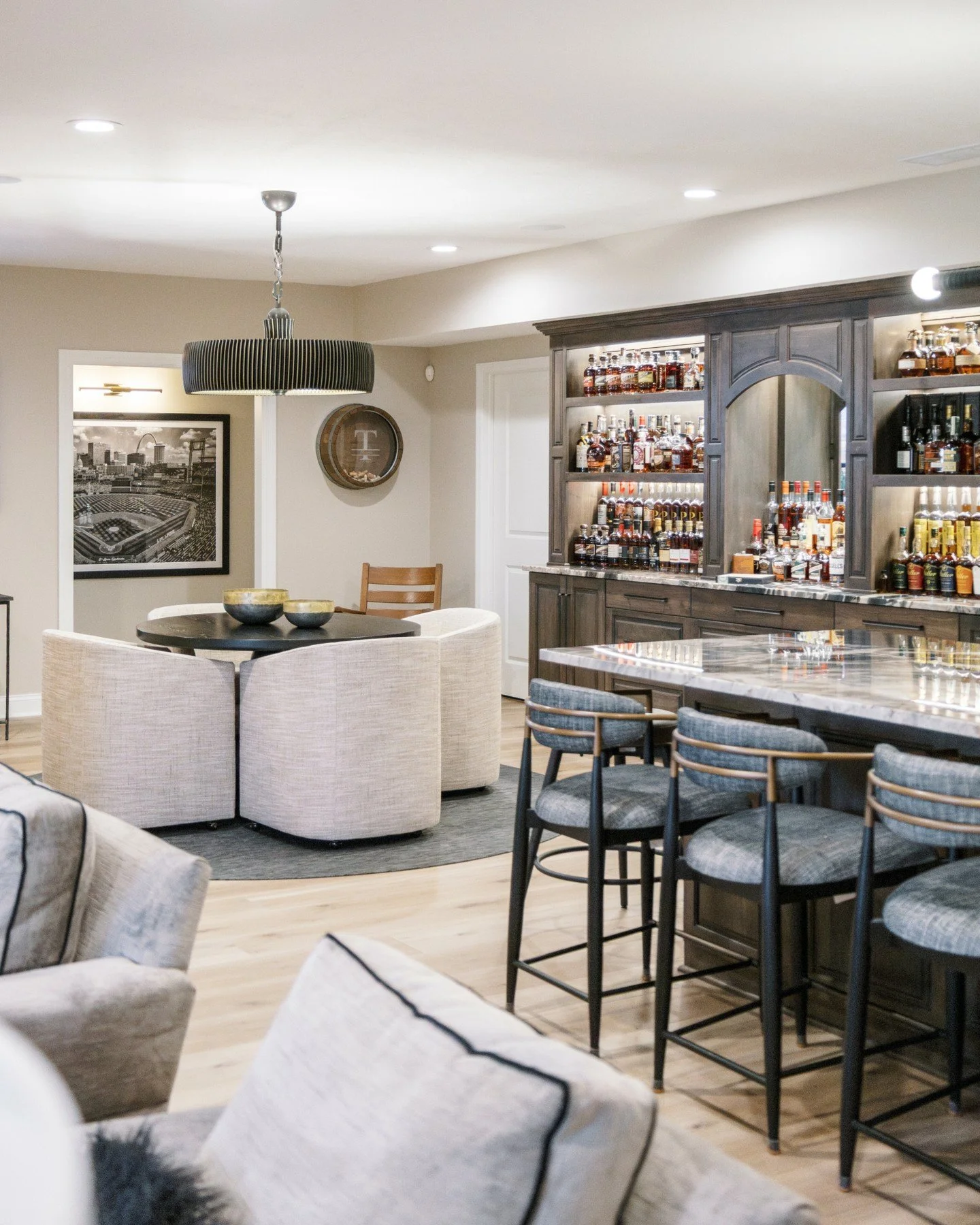Every space has a story and this one was ready for its next chapter. ✨

We reimagined this basement into a warm, welcoming retreat designed for gathering and unwinding.

🥃 The highlight: a custom built-in bourbon wall &mdash; our client&rsquo;s top 