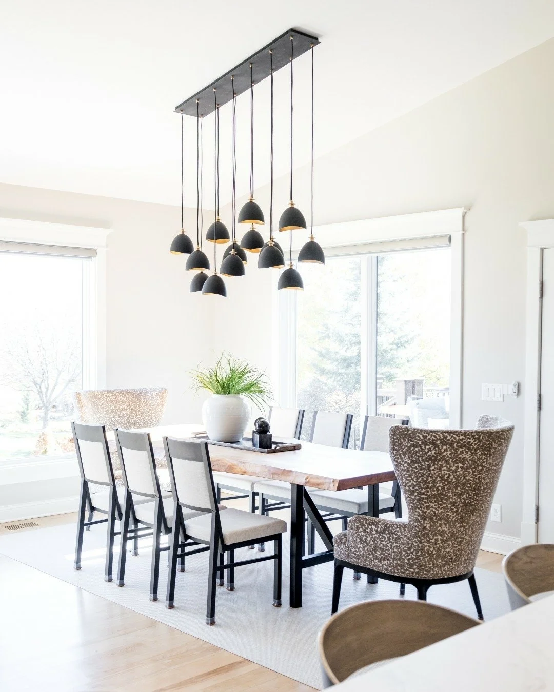 Dinner is served &mdash; and the lighting understood the assignment. 🍽️✨

As the sun sets, this room sets the mood for slow pours, second helpings, and stories that linger long after the plates are cleared. Warm wood, soft textures, and a table made