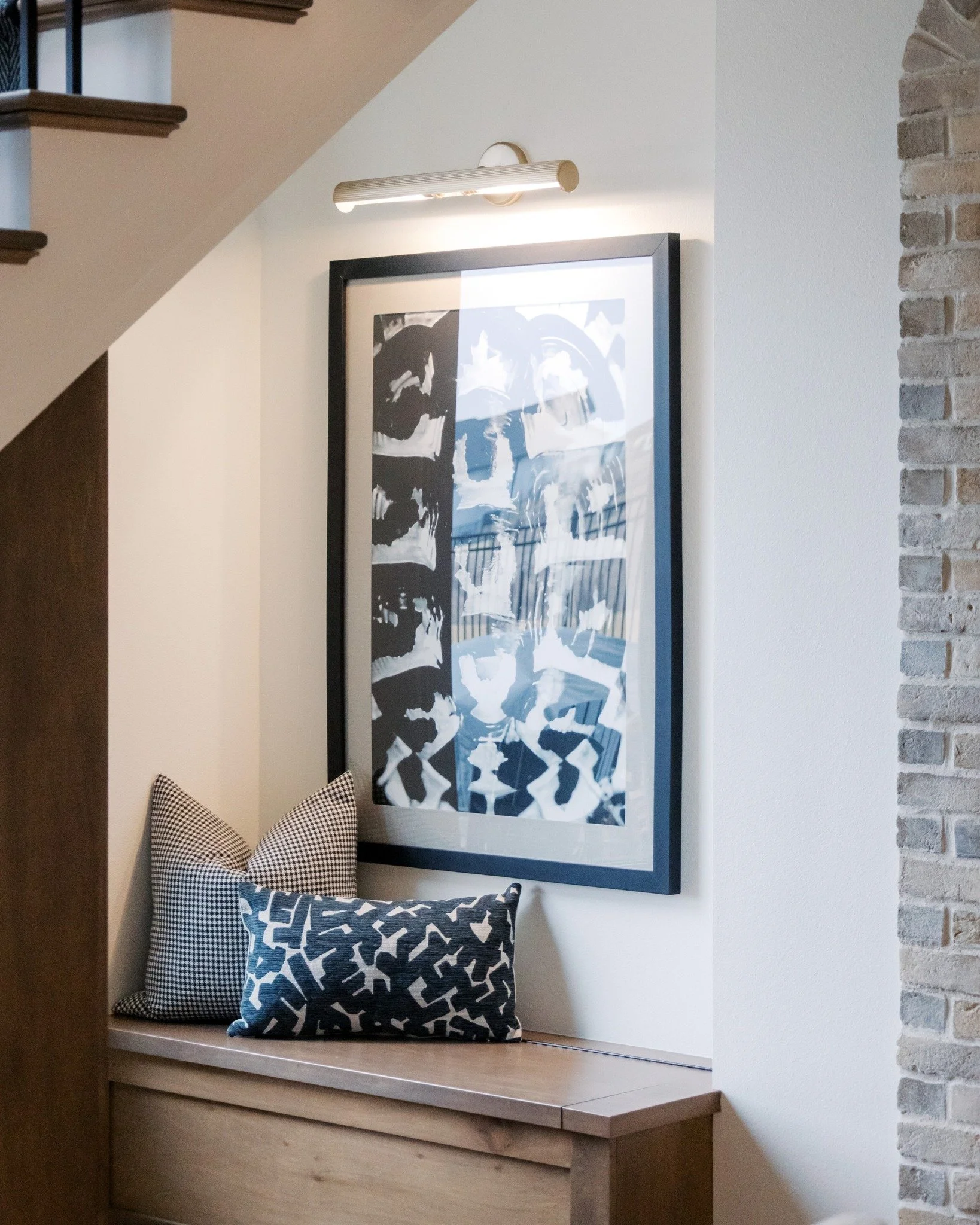 A cozy little nook made for real life ✨

Tucked beneath the stairs, this corner is equal parts charm and function&mdash;perfect for kicking off shoes, stacking bags, or giving the kids a spot of their own 🤍

#CozyNooks
#theWAYSway
#WAYSInteriors
#Om