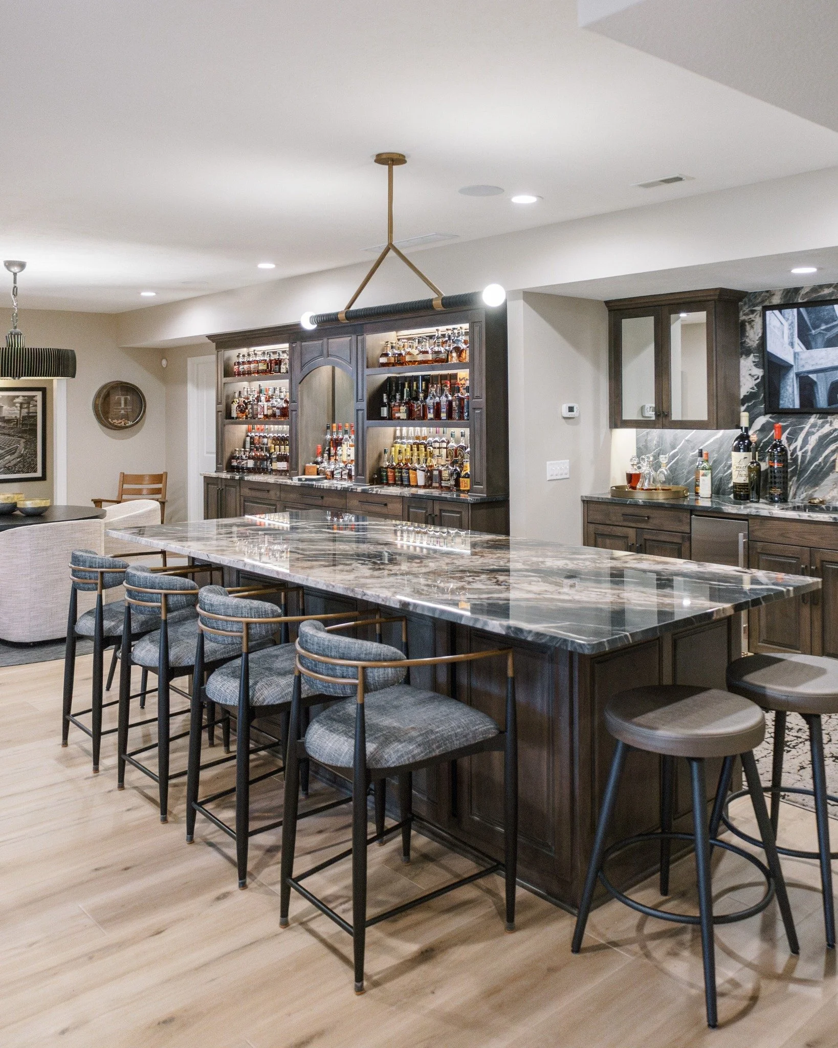 Swipe slowly. You'll want to see every detail. ✨

A basement bar transformation that proves good design changes how you live in your home. Dark cabinetry, marble countertops, warm lighting, and a layout that just works. This is the WAYS way.

Would y