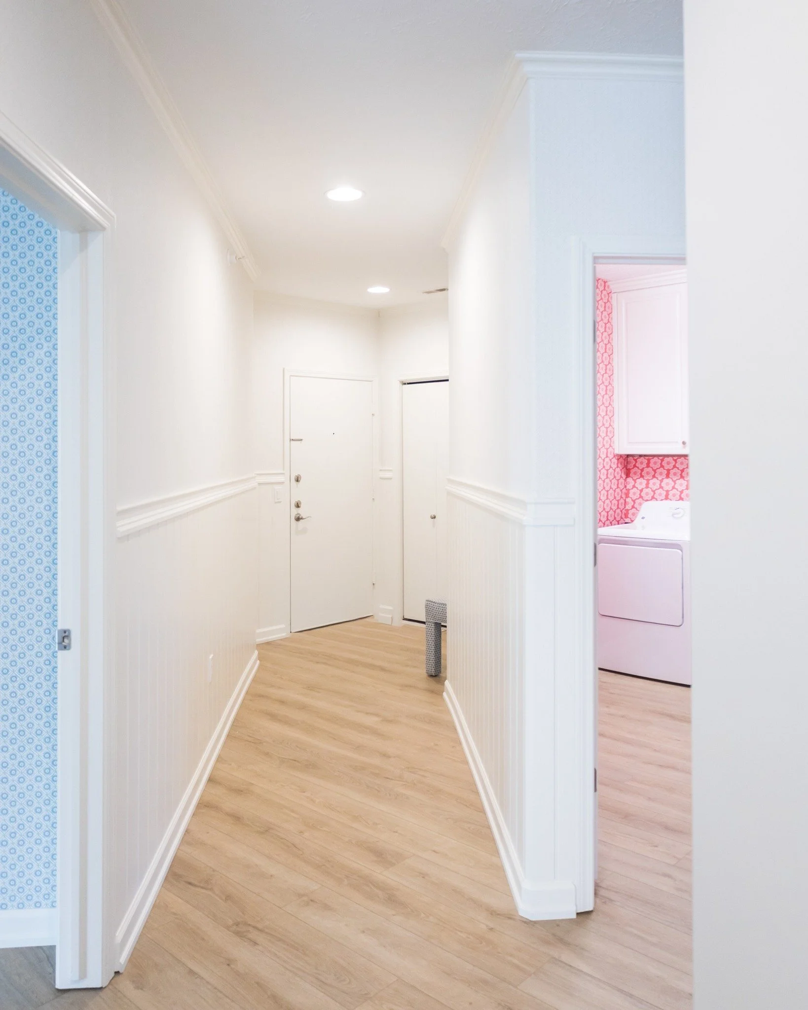 Hallways deserve love too. 🏠

We don't skip the in-between spaces around here. This condo update took a dark, builder-grade hallway and turned it into something custom and beautiful.

Beadboard. New floors. The wallpaper installed above the chair ra