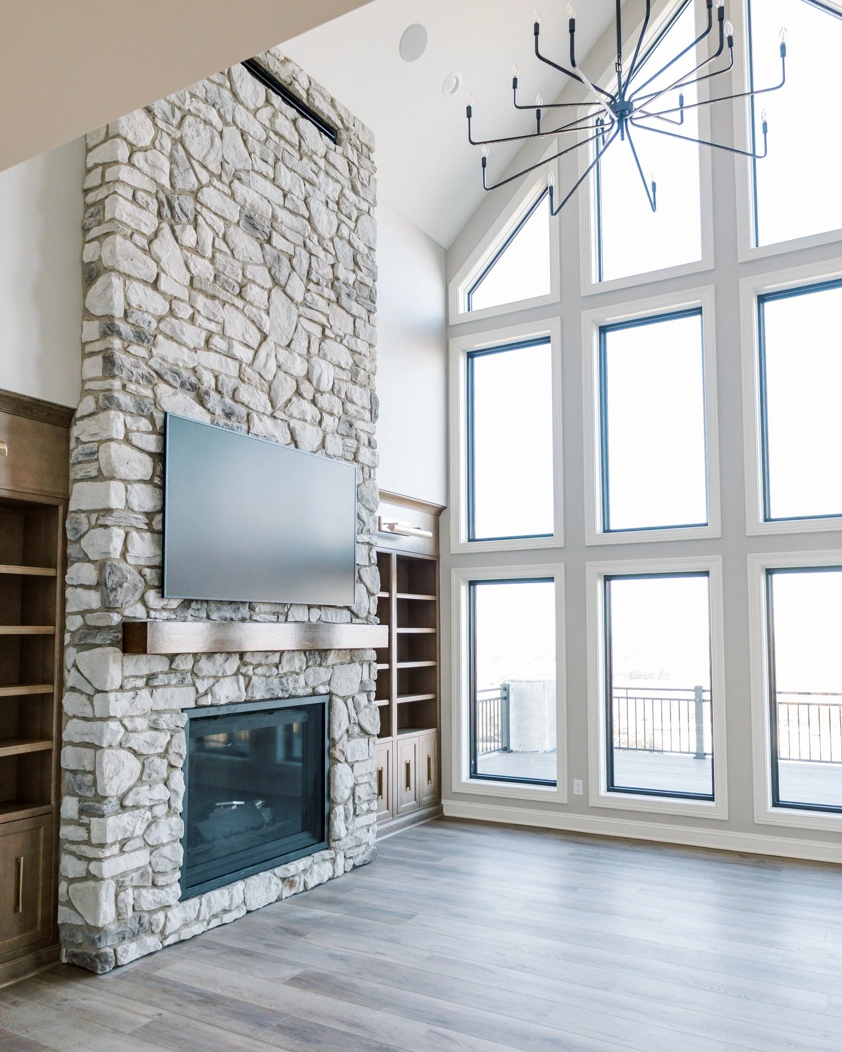 Floor-to-ceiling stone. Wall-to-wall windows. ✨

The kind of space that makes you want to cancel your plans and just... stay home. 🔥

What's your must-have in a living room &mdash; a fireplace, big windows, or both?

#WAYSInteriors 
#theWAYSway 
#Om
