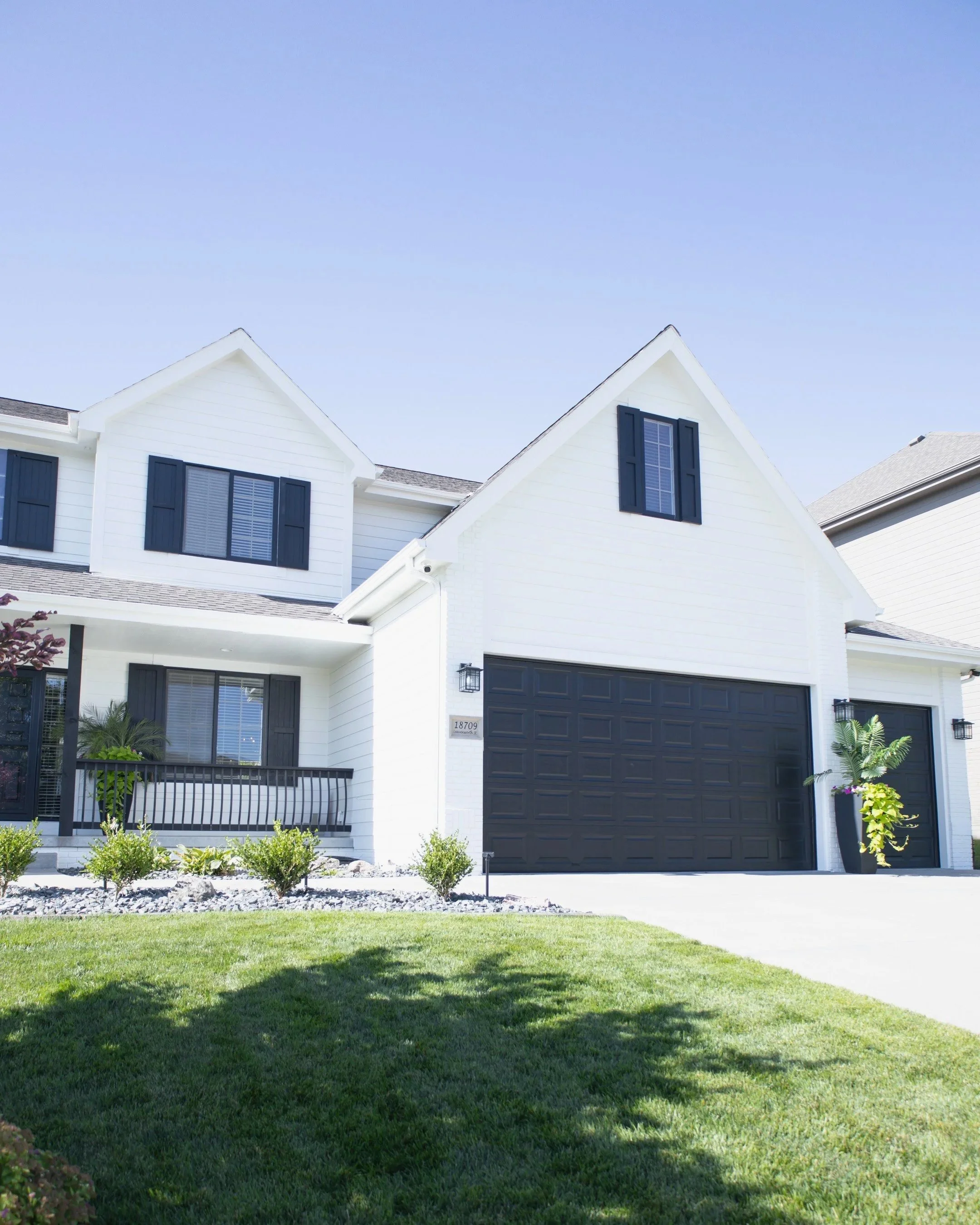 alt="Exterior home paint and color design by Omaha-based interior designers at WAYS Interiors"