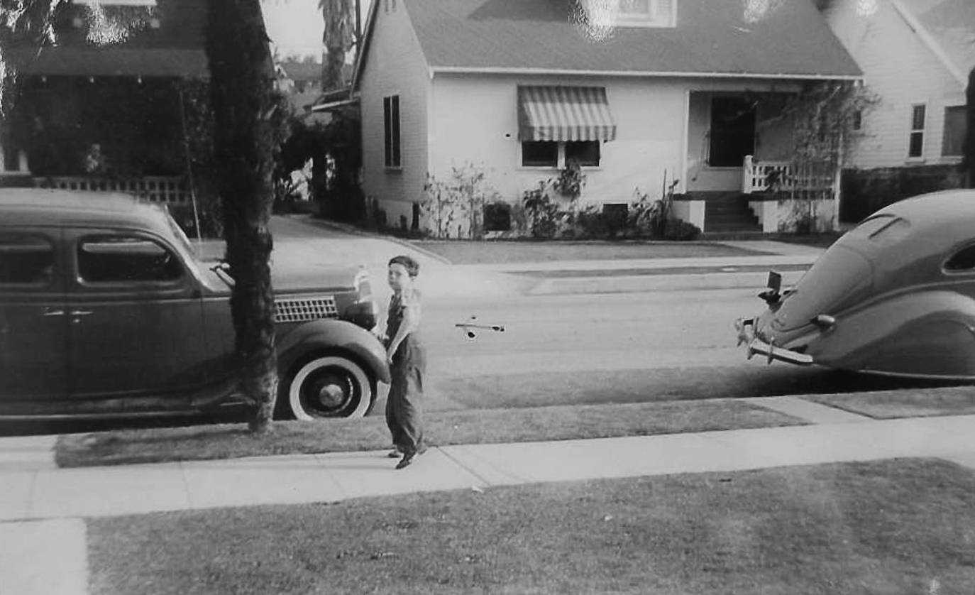 This is the photo that the Downs submitted to document that they'd owned the car they were claiming for. It's the car on the left, behind Eunice Down's little brother.