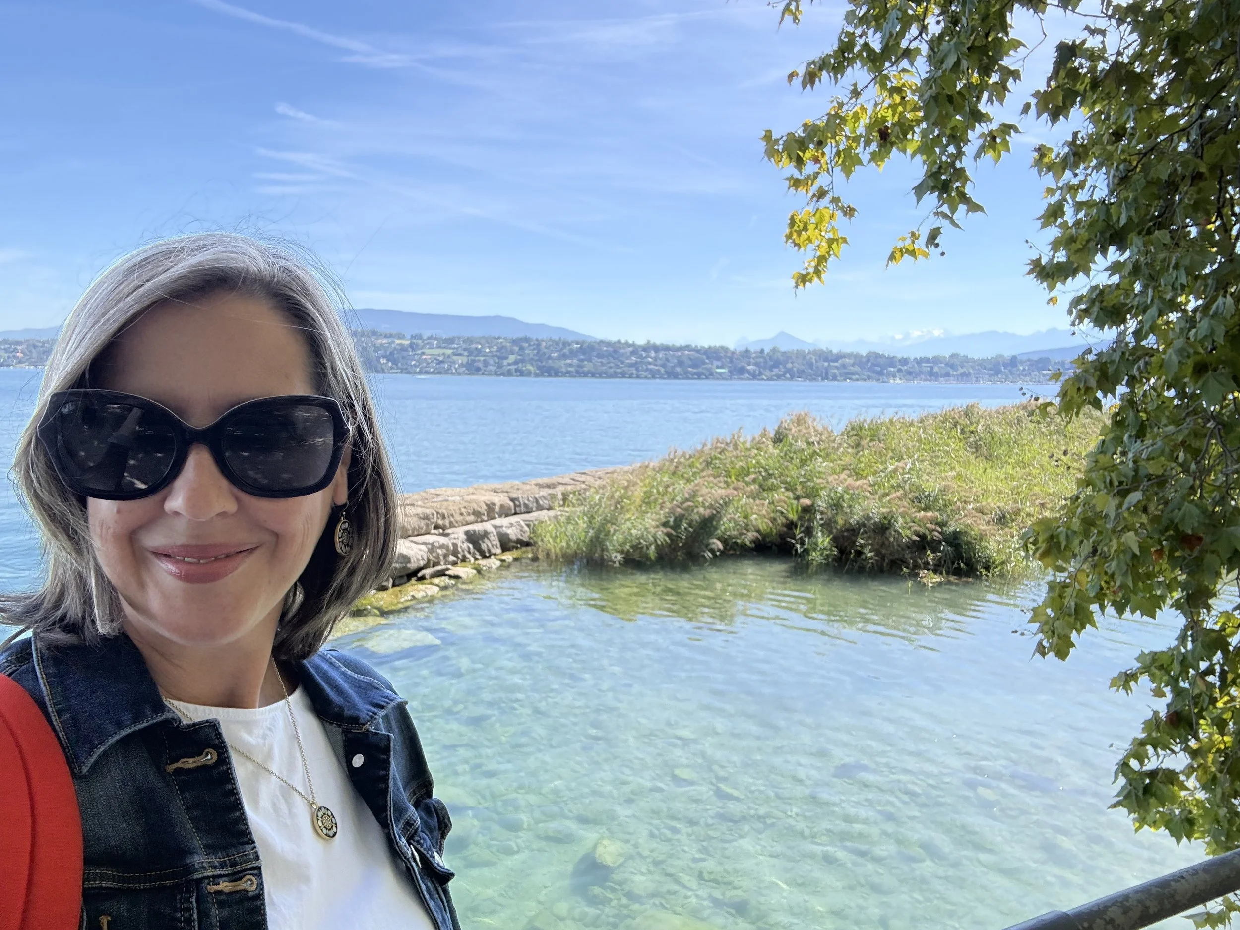 woman standing in front of Lake Geneva