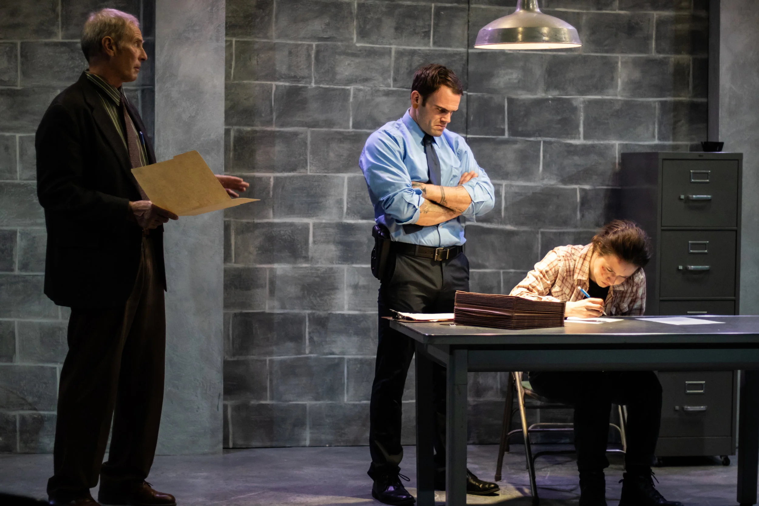Jaime Jastrab as Tupolski, Rose Grizzell as Katurian, and Rob Schreiner as Ariel in The Constructivists' production of “The Pillowman,” by Martin McDonagh, Directed by Jaimelyn Gray. Photos by Christal Wagner Photography. October 26 – November 10, 2018 at The Underground Collaborative, 161 W. Wisconsin Ave, Milwaukee, Wisconsin.
