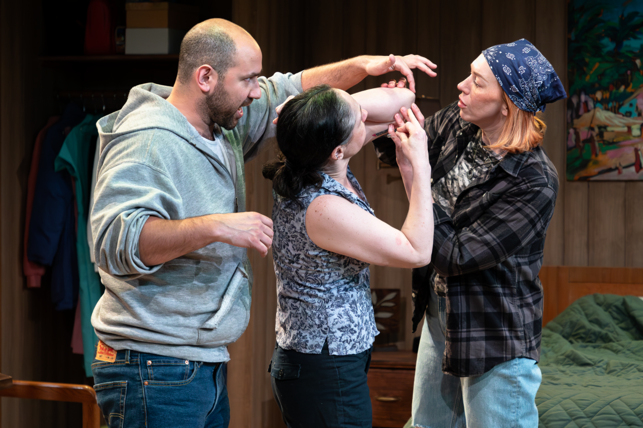  Joe Lino (Peter), Jaimelyn Gray (Agnes), Tess Cinpinski (R.C.) BUG By Tracy Letts April 25-May 9, 2026 Directed by Maya Danks Photo by Jake Badovski, Kłamię Studios Scenic Design: Sarah Harris, with Set Construction: Les Zarzecki, Lighting Design: E