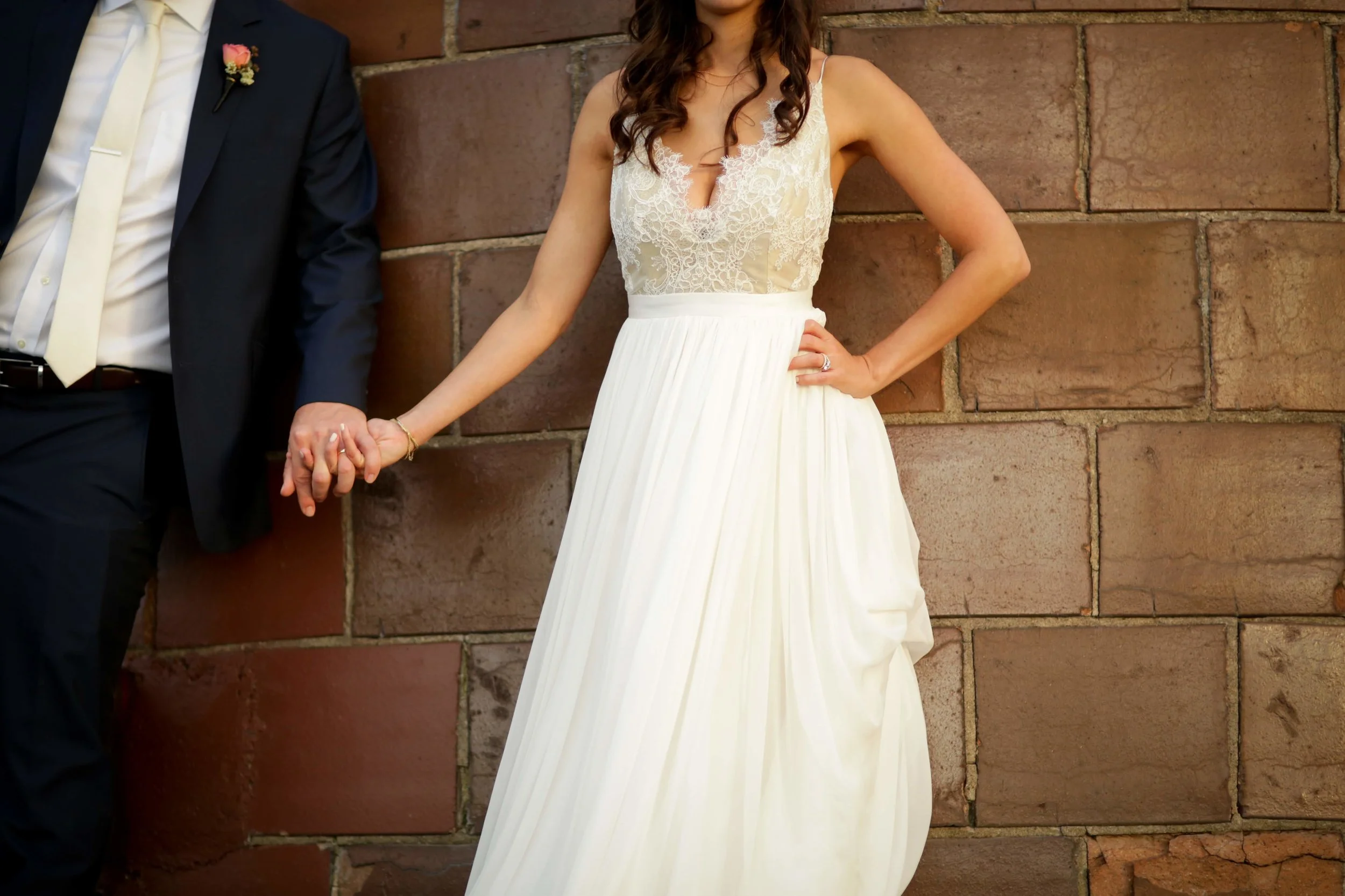 Bride and Groom posing on Silo